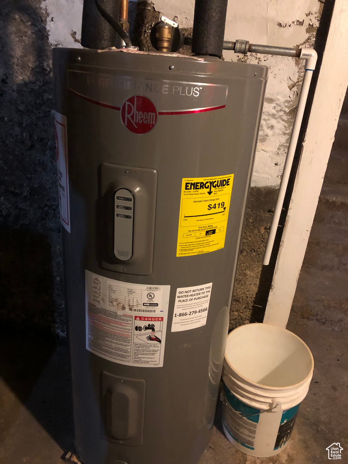 Utility room featuring electric water heater
