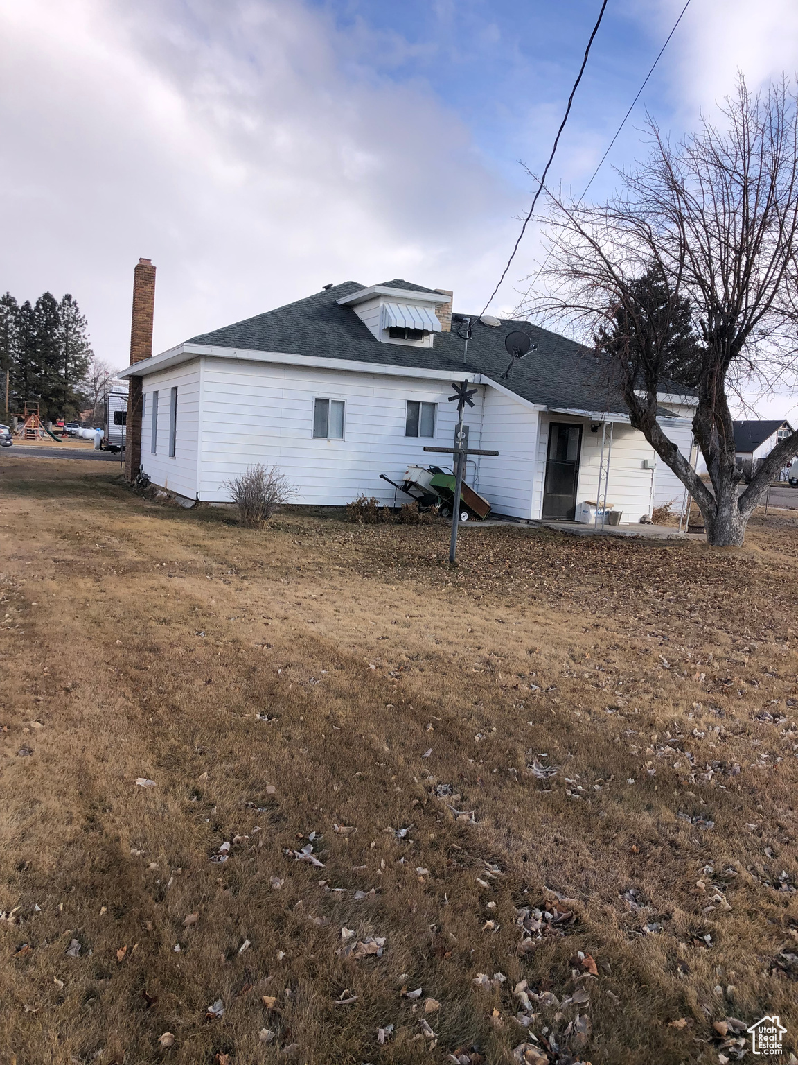 Back of house featuring a lawn