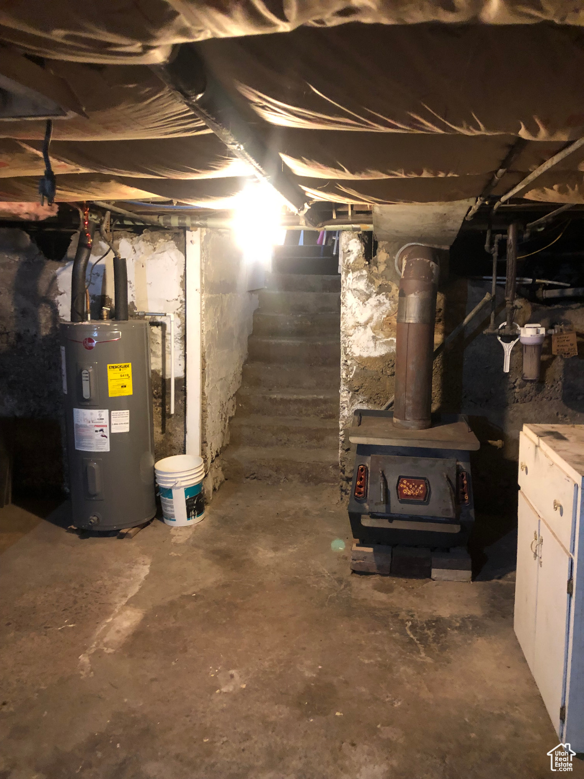 Basement featuring electric water heater