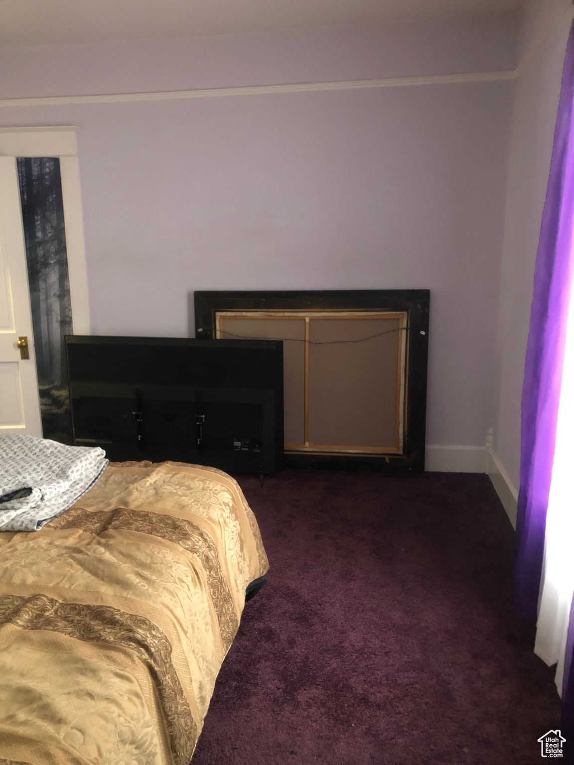 Bedroom featuring dark carpet