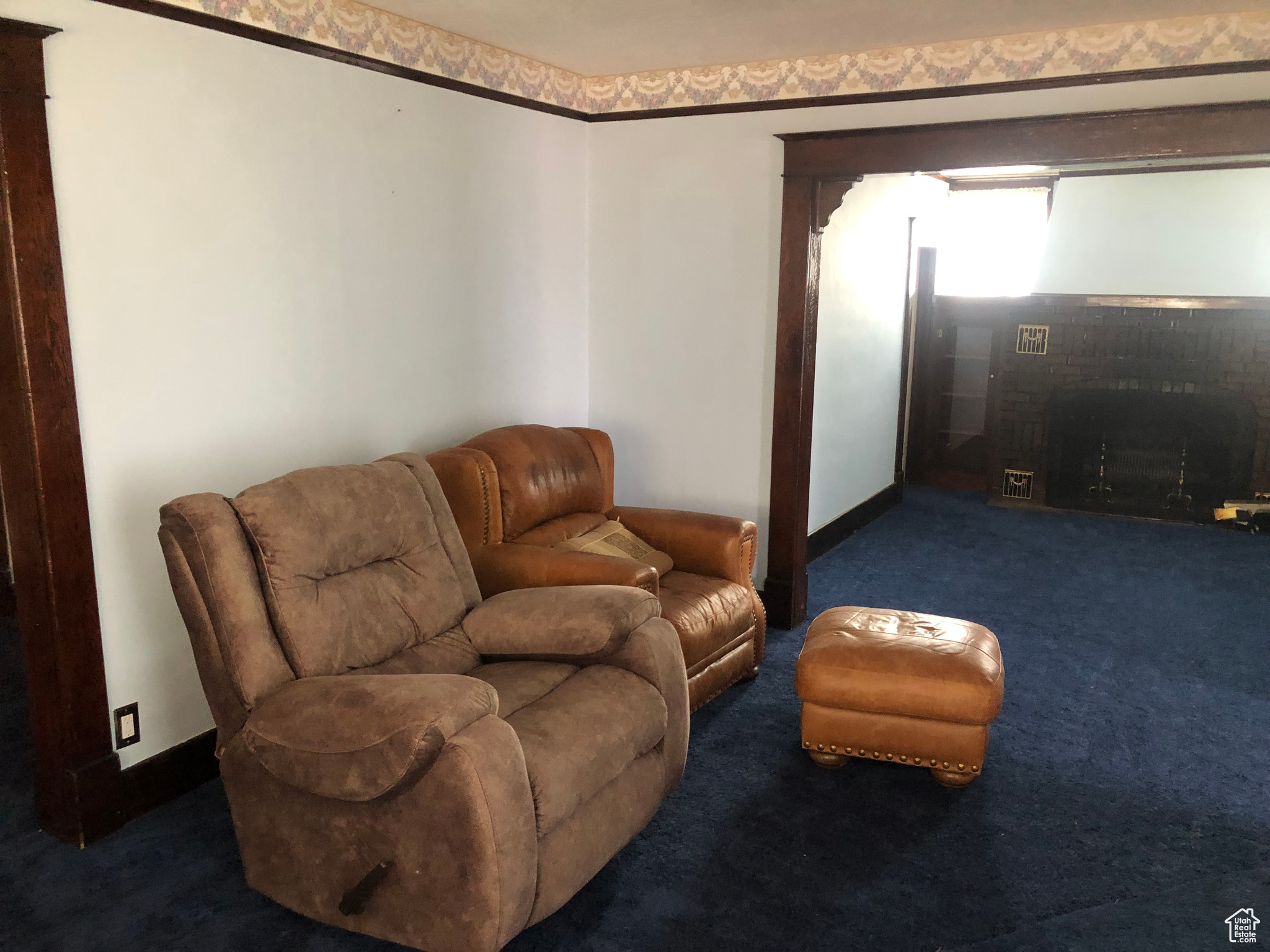Living room featuring dark colored carpet