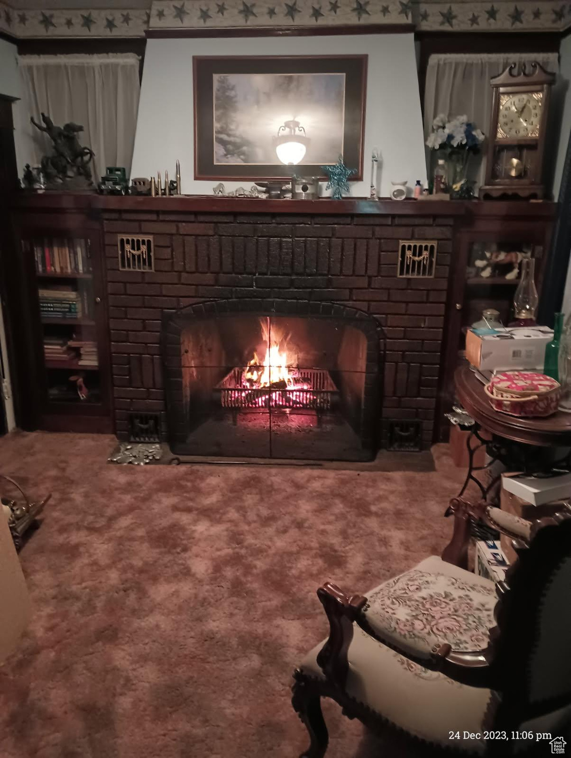Interior space with carpet floors and a fireplace