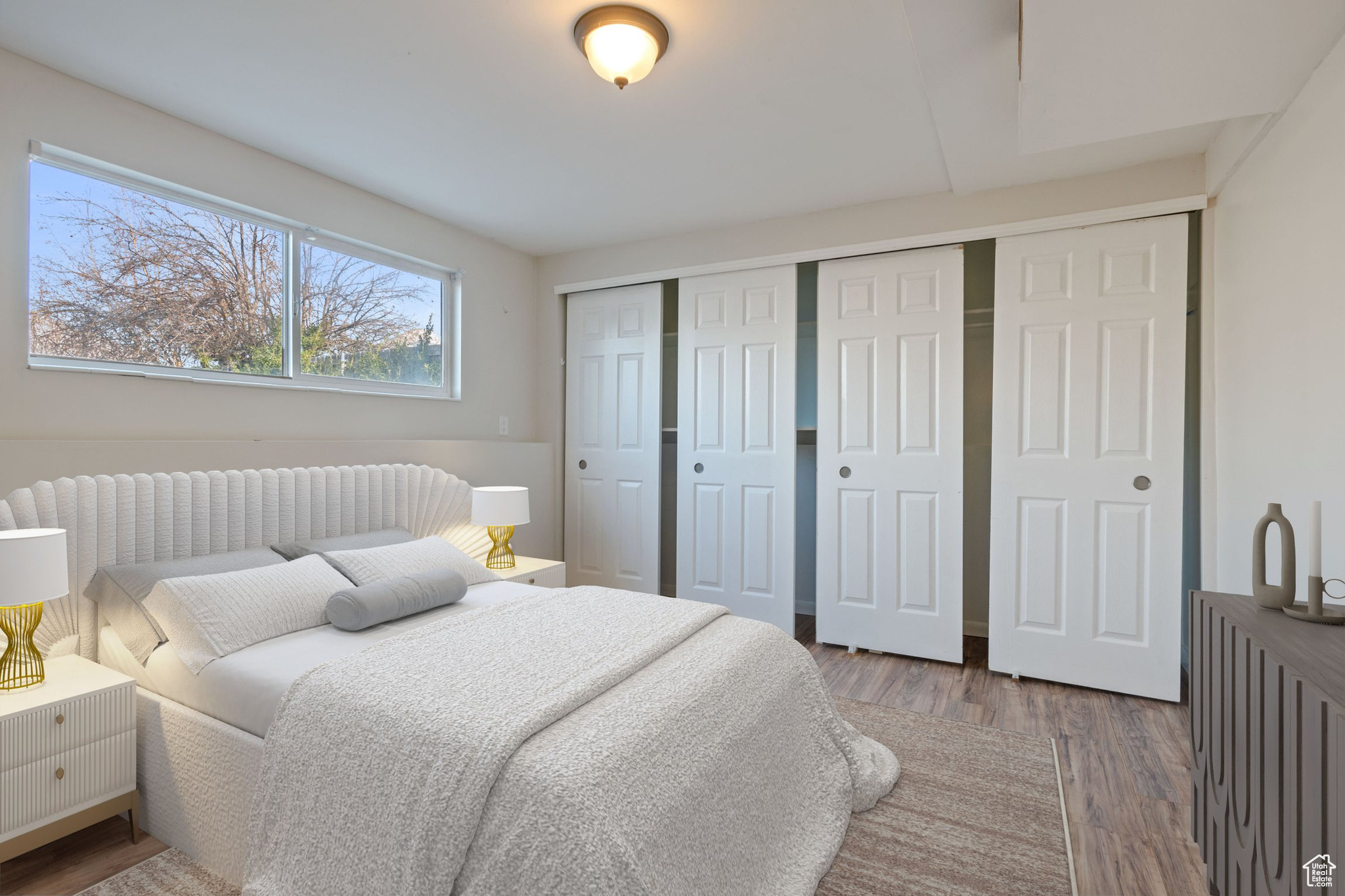 Bedroom featuring a closet and wood finished floors