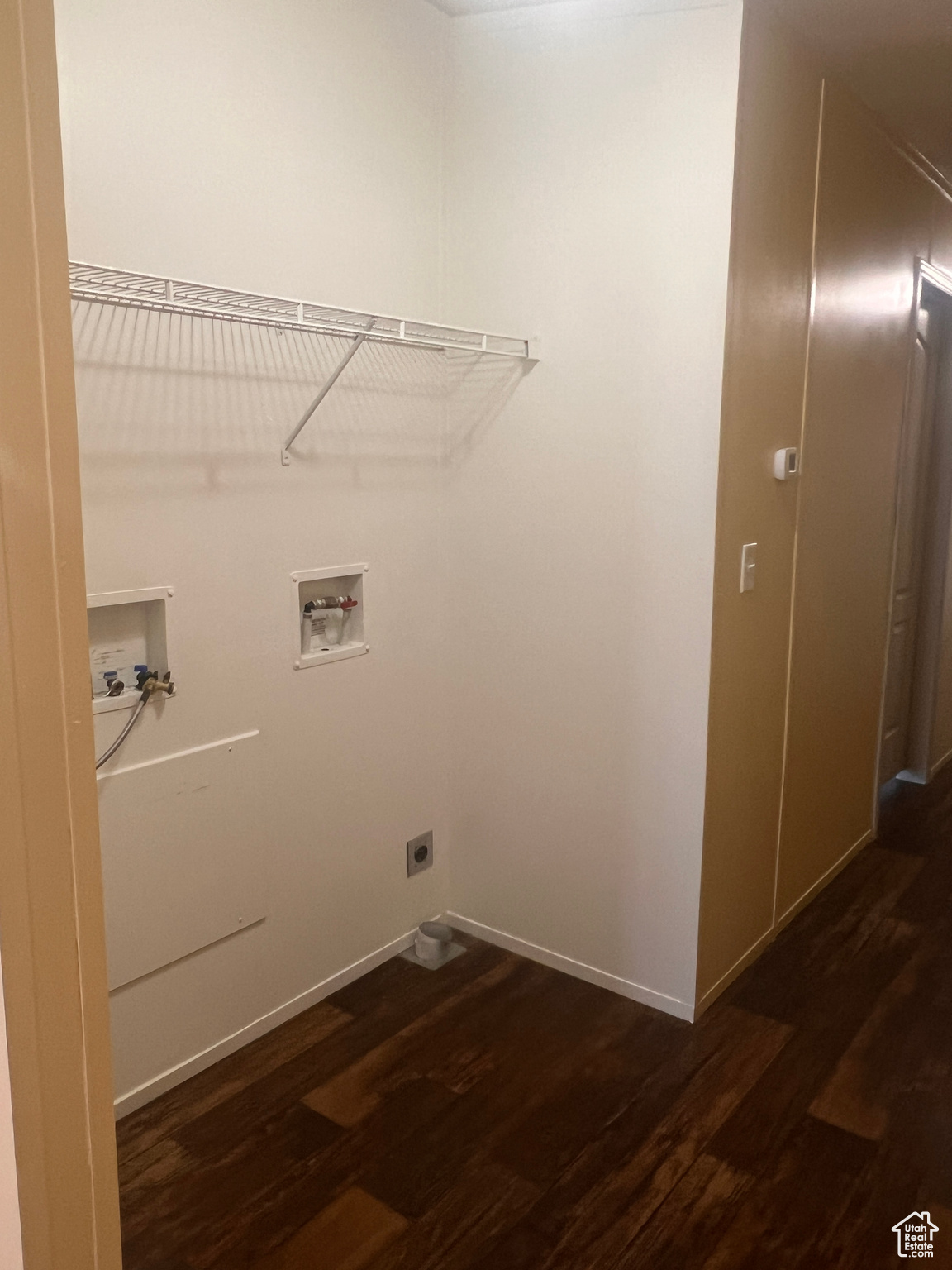 Clothes washing area with washer hookup, laundry area, dark wood-style flooring, and electric dryer hookup