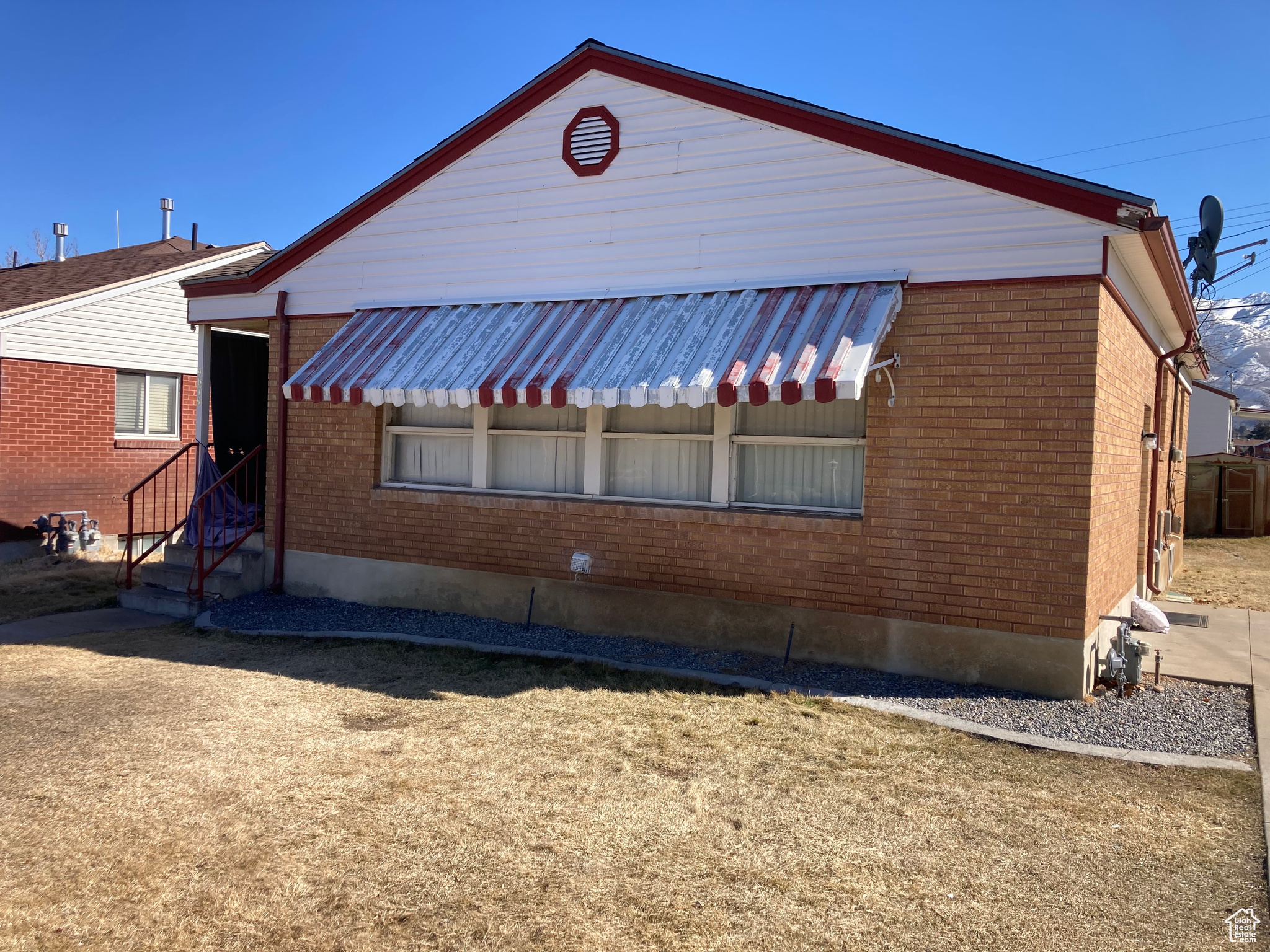 View of side of home with brick siding