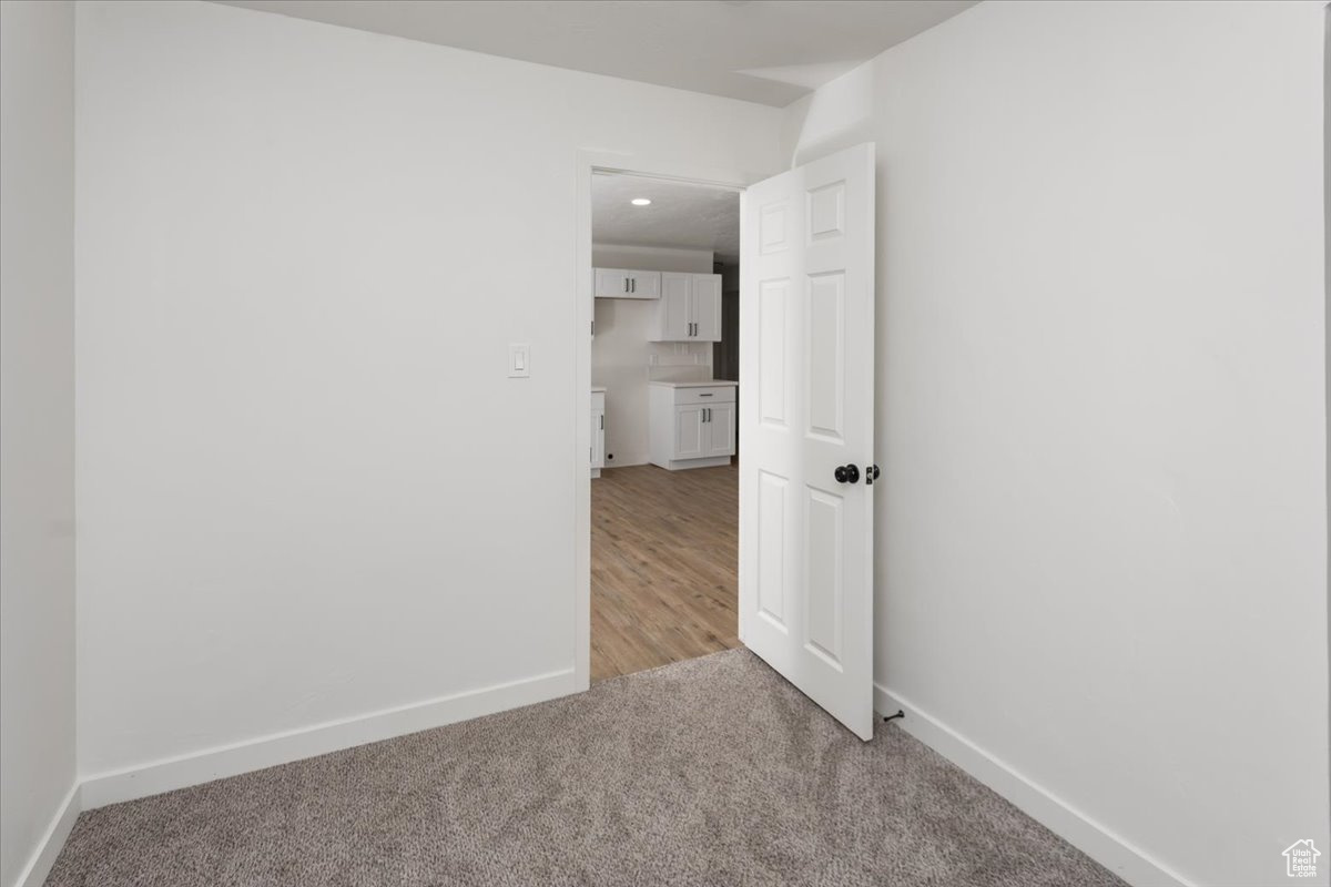 Interior space featuring light colored carpet