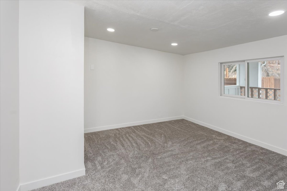 Empty room with carpet flooring