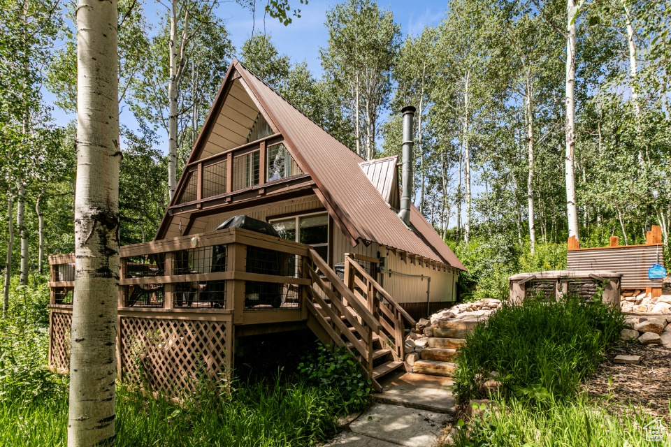 Back of property with a deck