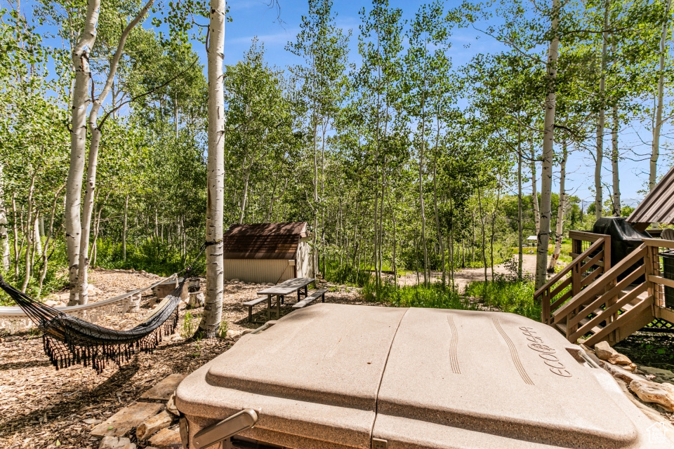 View of patio featuring a shed