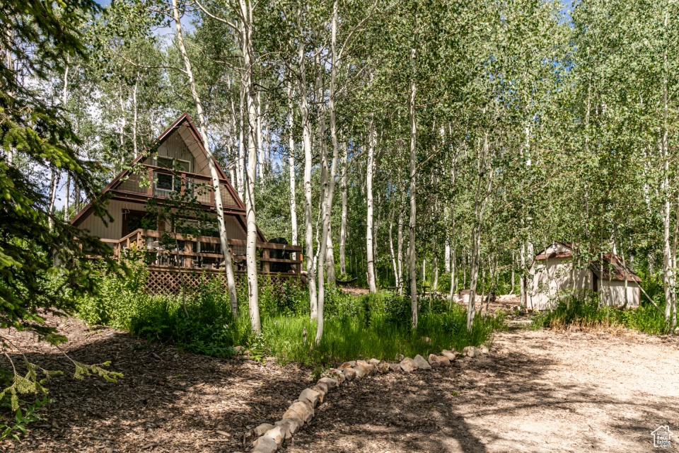 View of yard with a deck