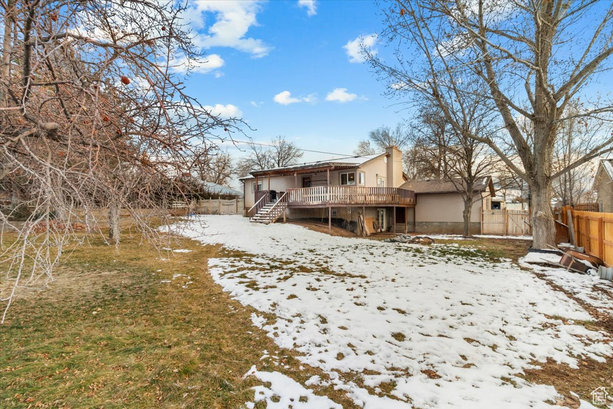 property with a yard and a deck