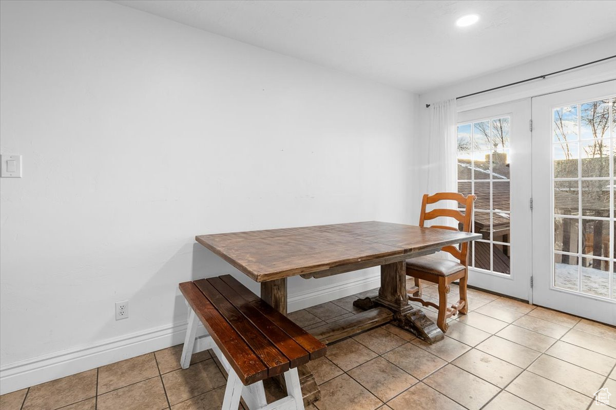 Dining room featuring light tile patterned floors