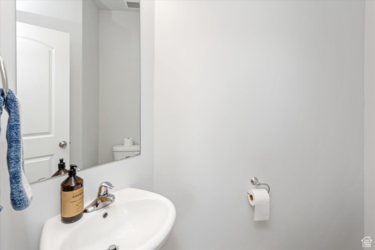 Bathroom with sink and toilet