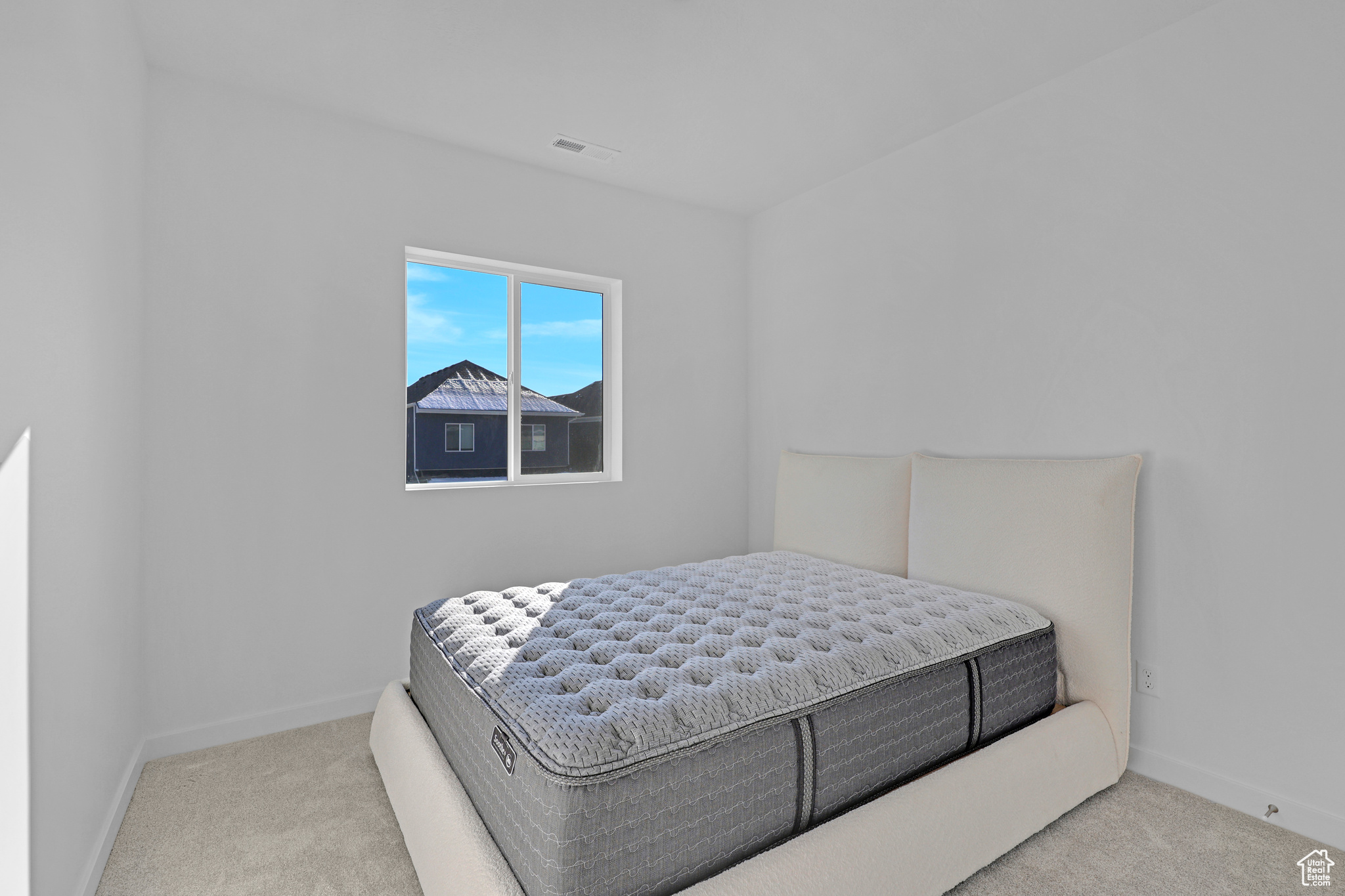 Bedroom with carpet flooring