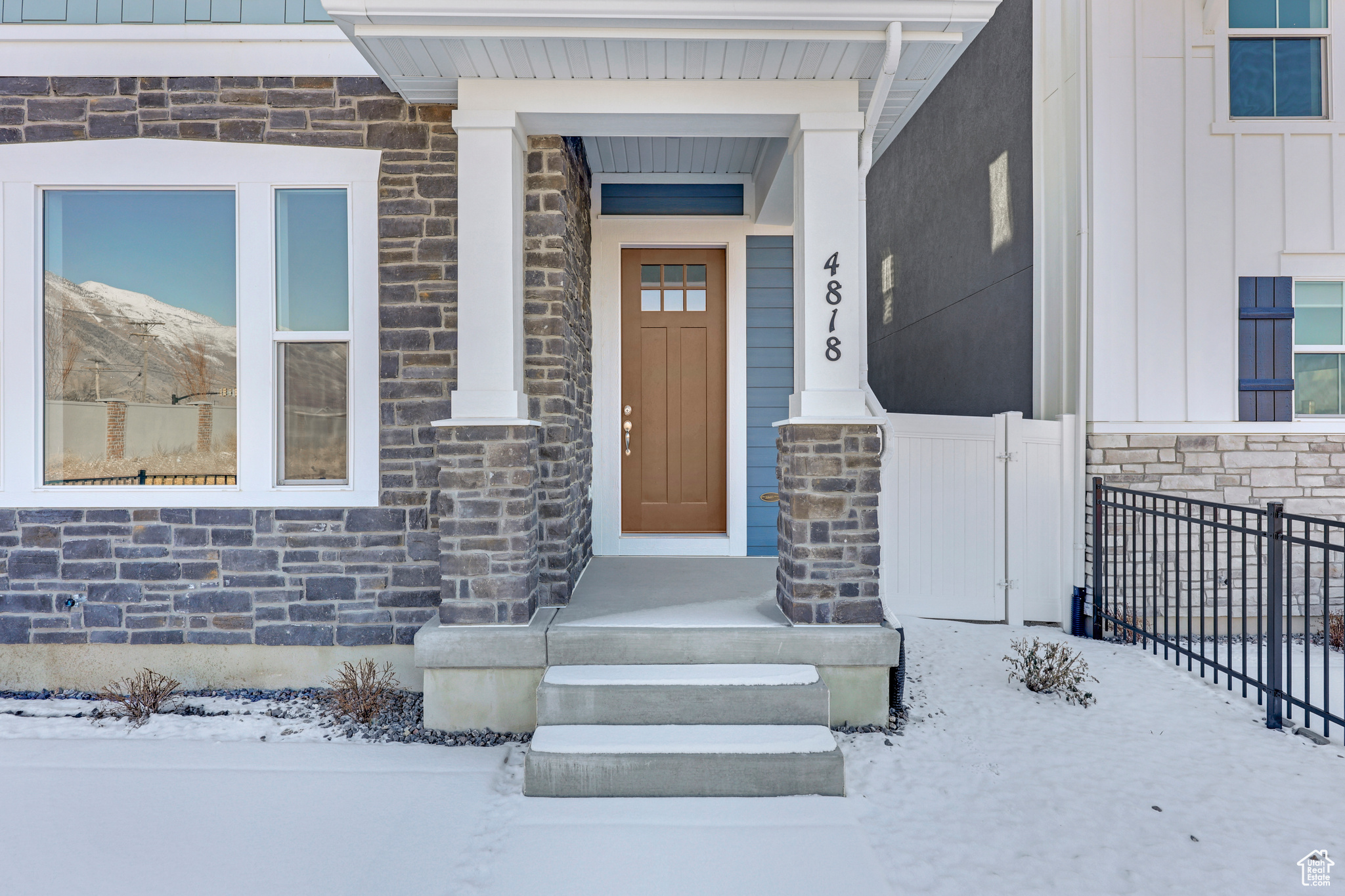 View of snow covered property entrance