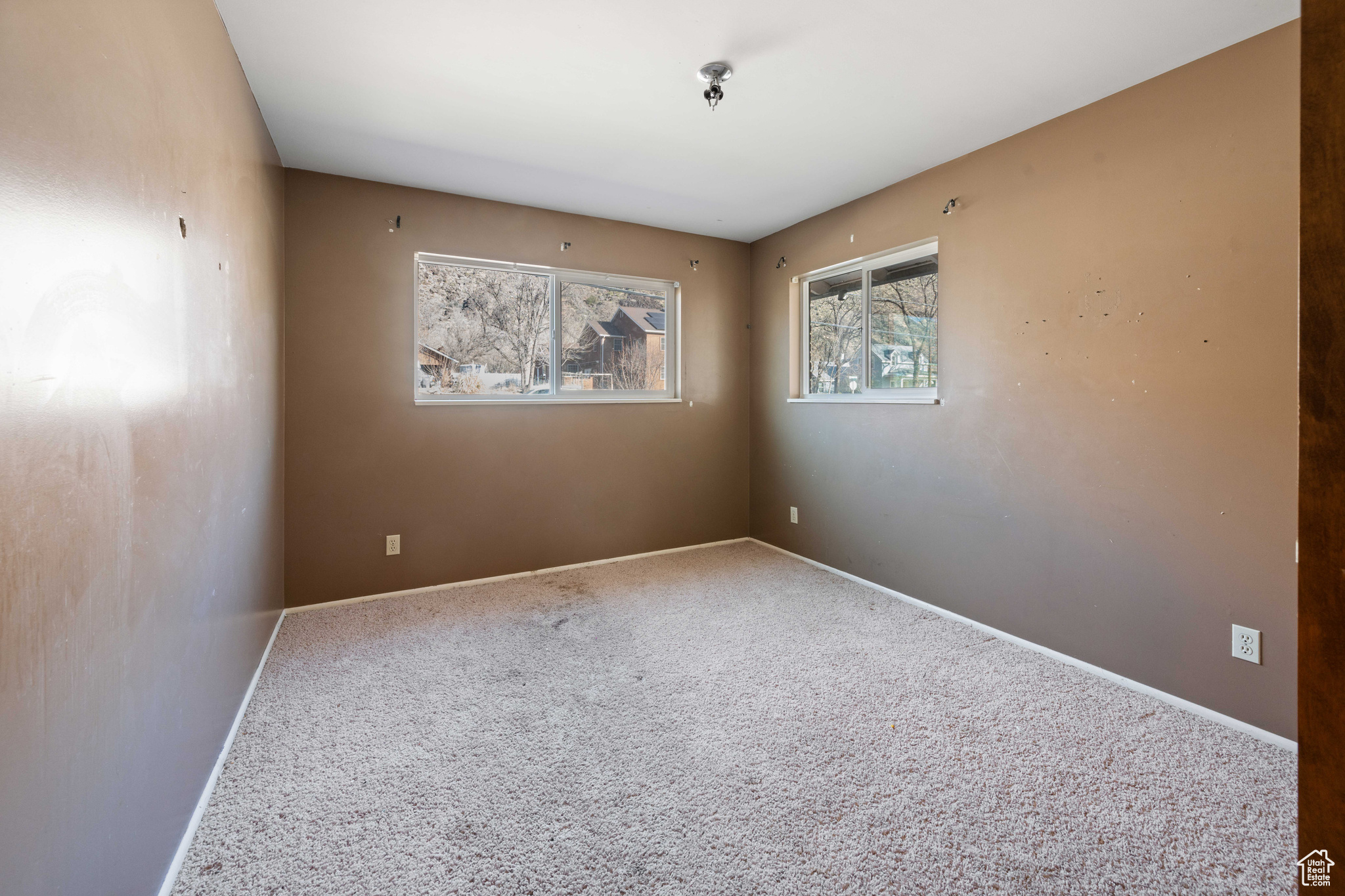 View of carpeted spare room