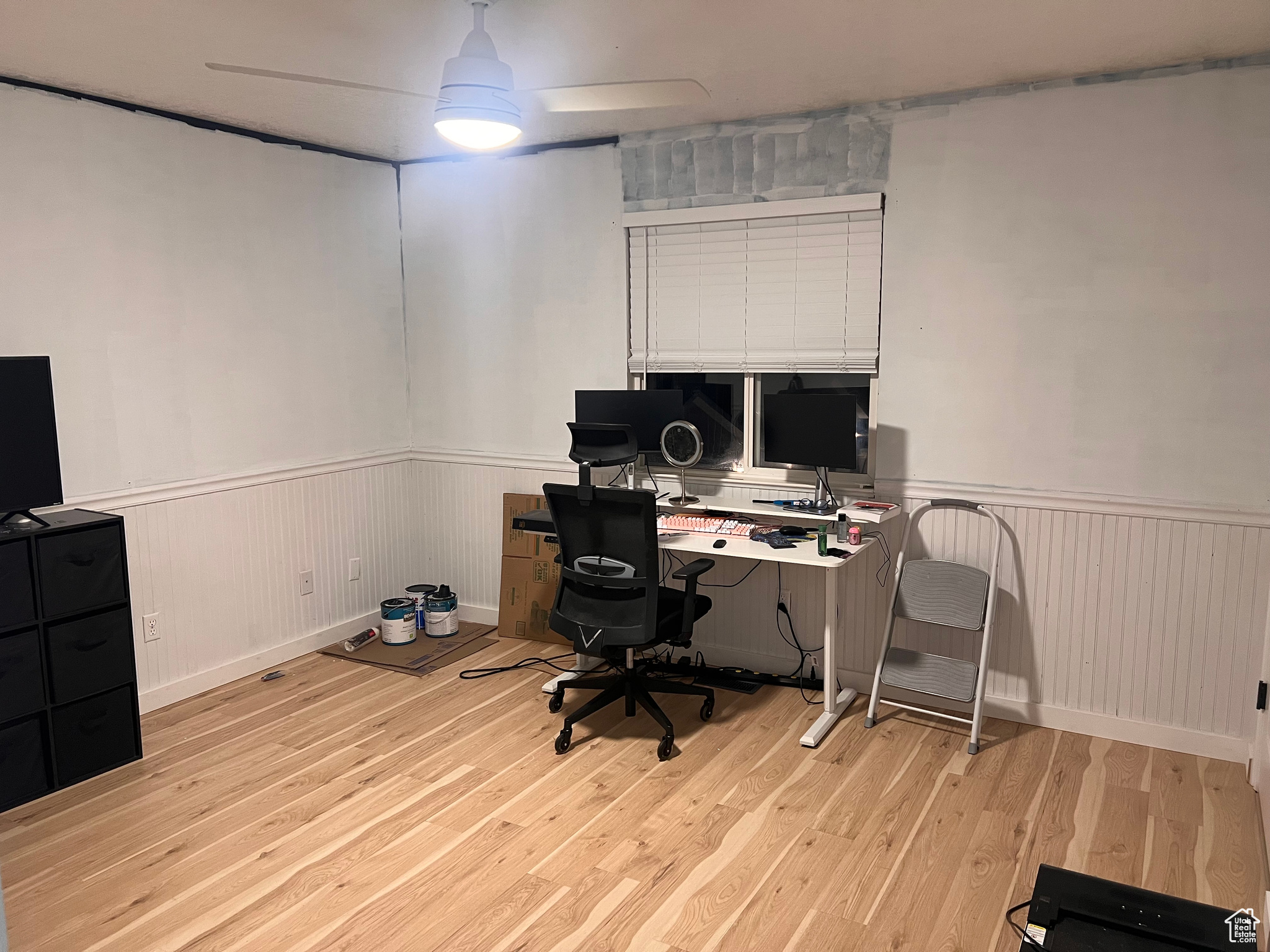 Office area with ceiling fan and light wood-type flooring
