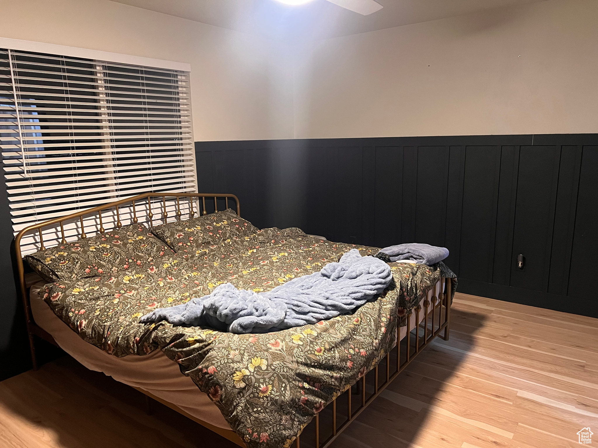 Bedroom featuring ceiling fan and light wood-type flooring