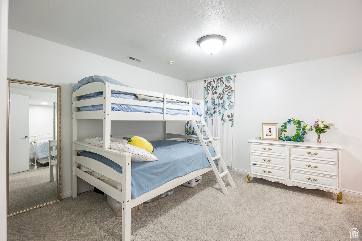 Bedroom featuring carpet