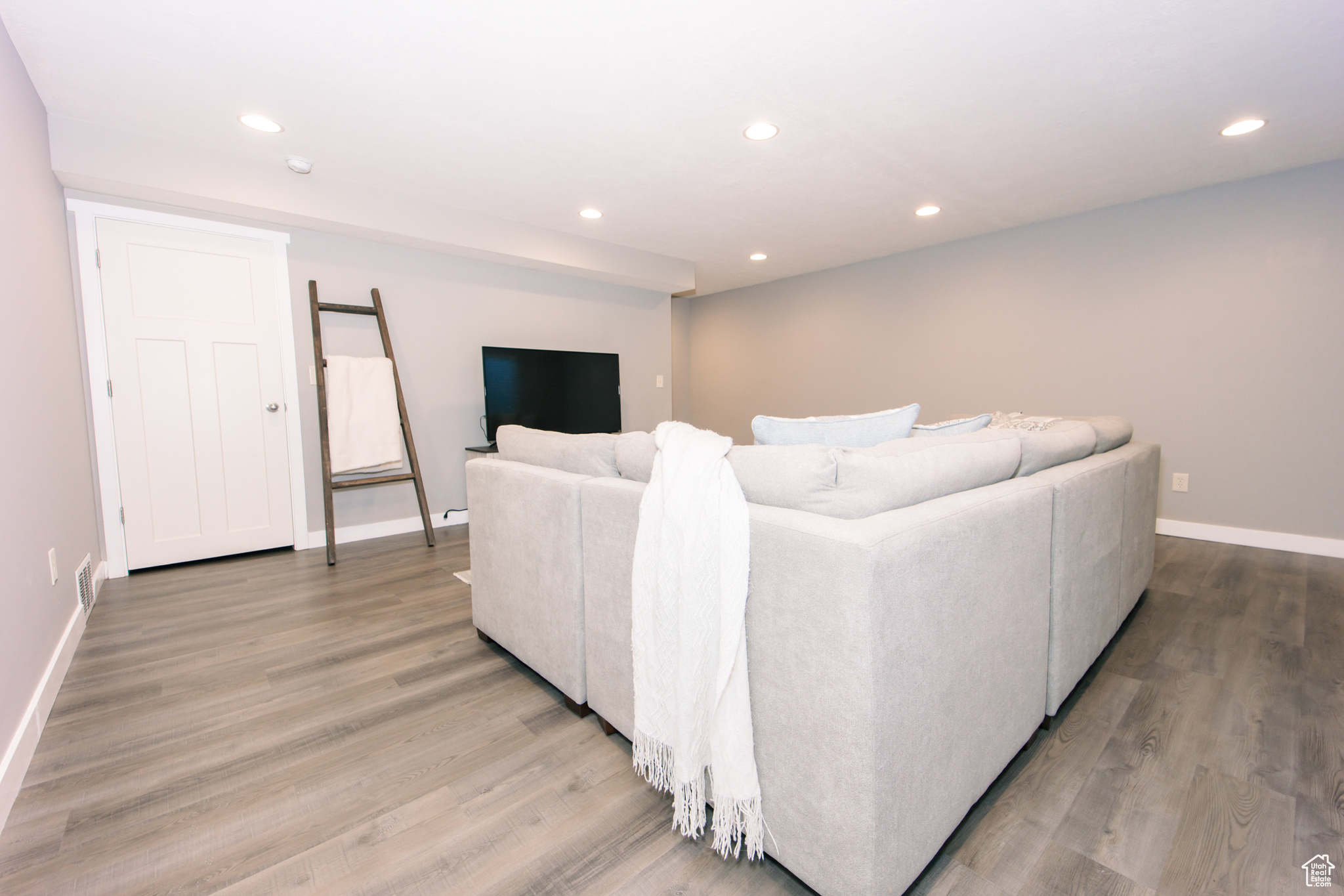 Living room with light hardwood / wood-style floors