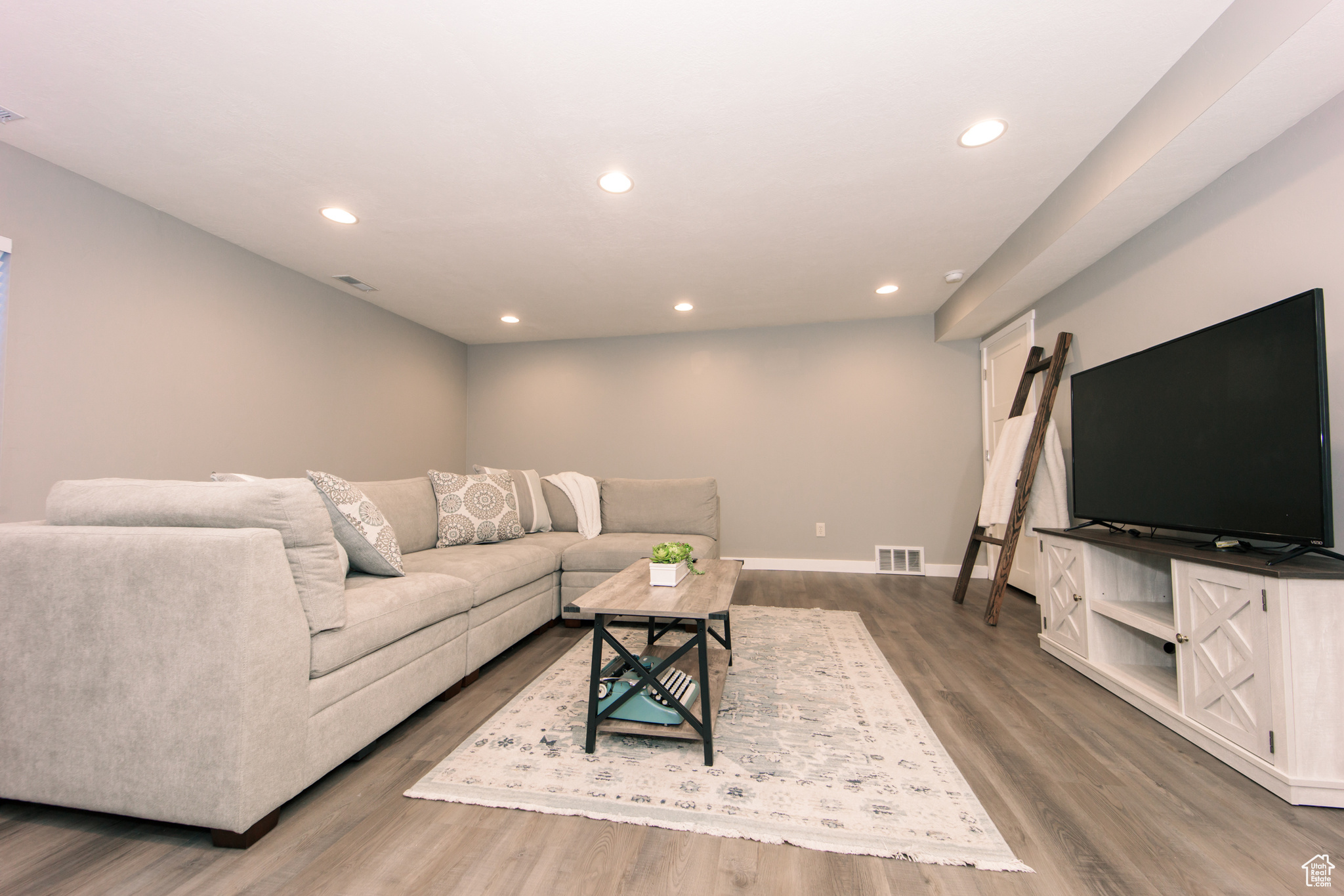 Living room with hardwood / wood-style flooring