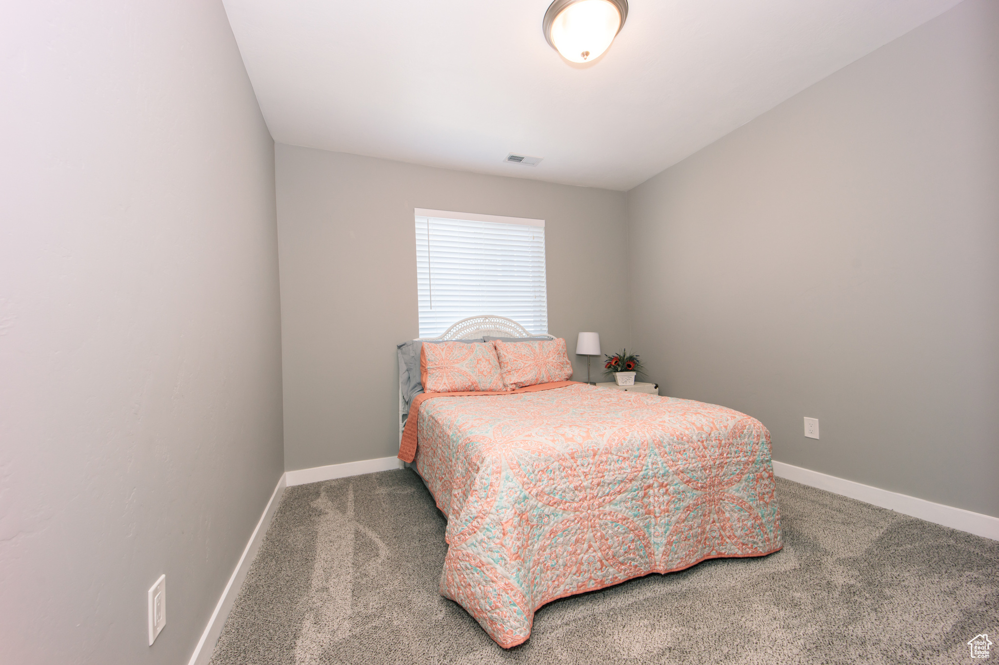 Bedroom with carpet flooring