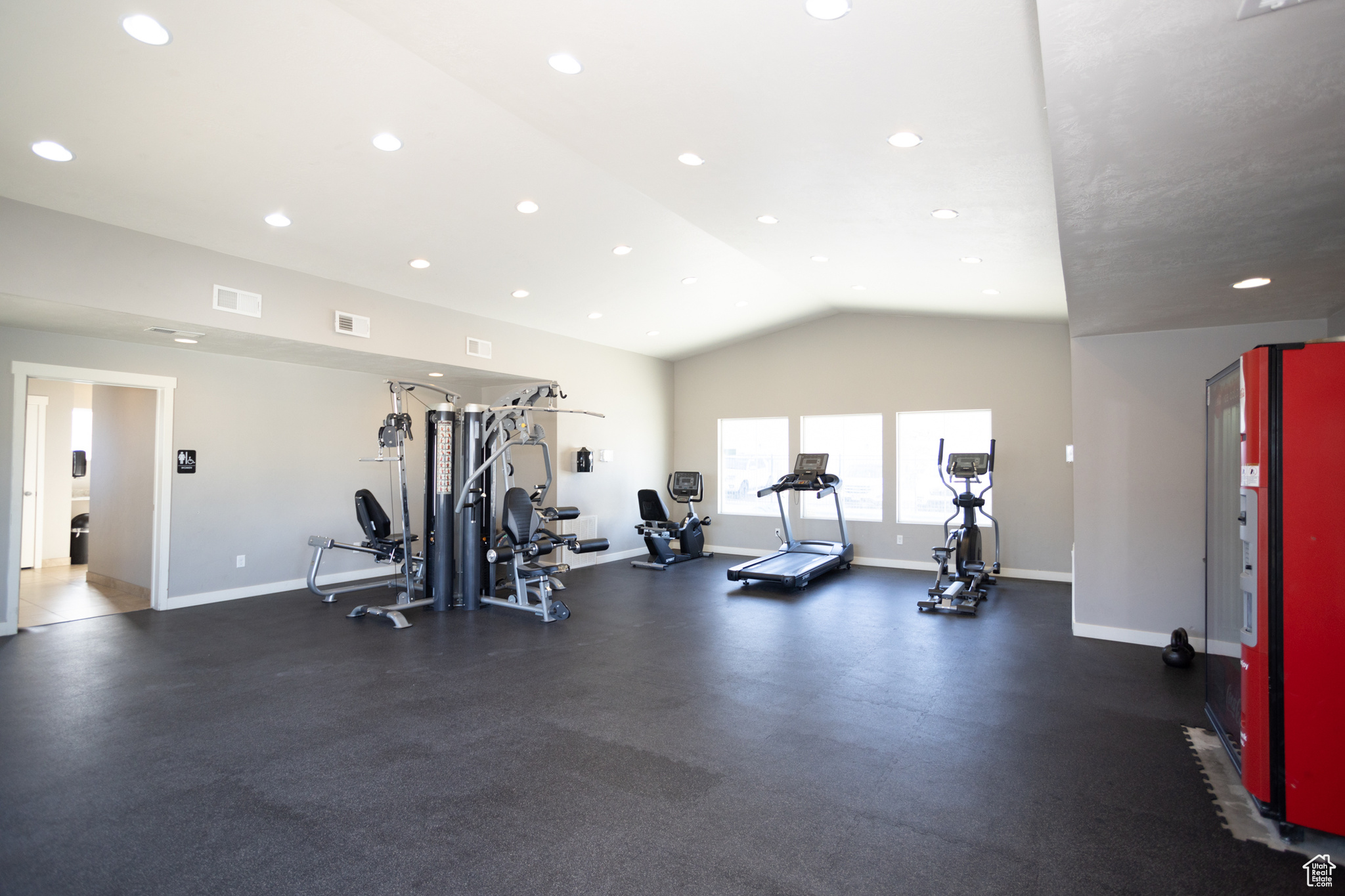 Gym featuring vaulted ceiling