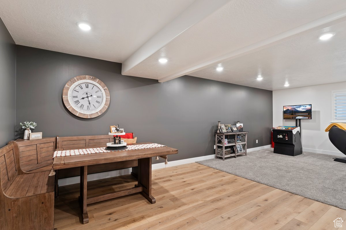 Basement Dining room featuring light wood-type flooring