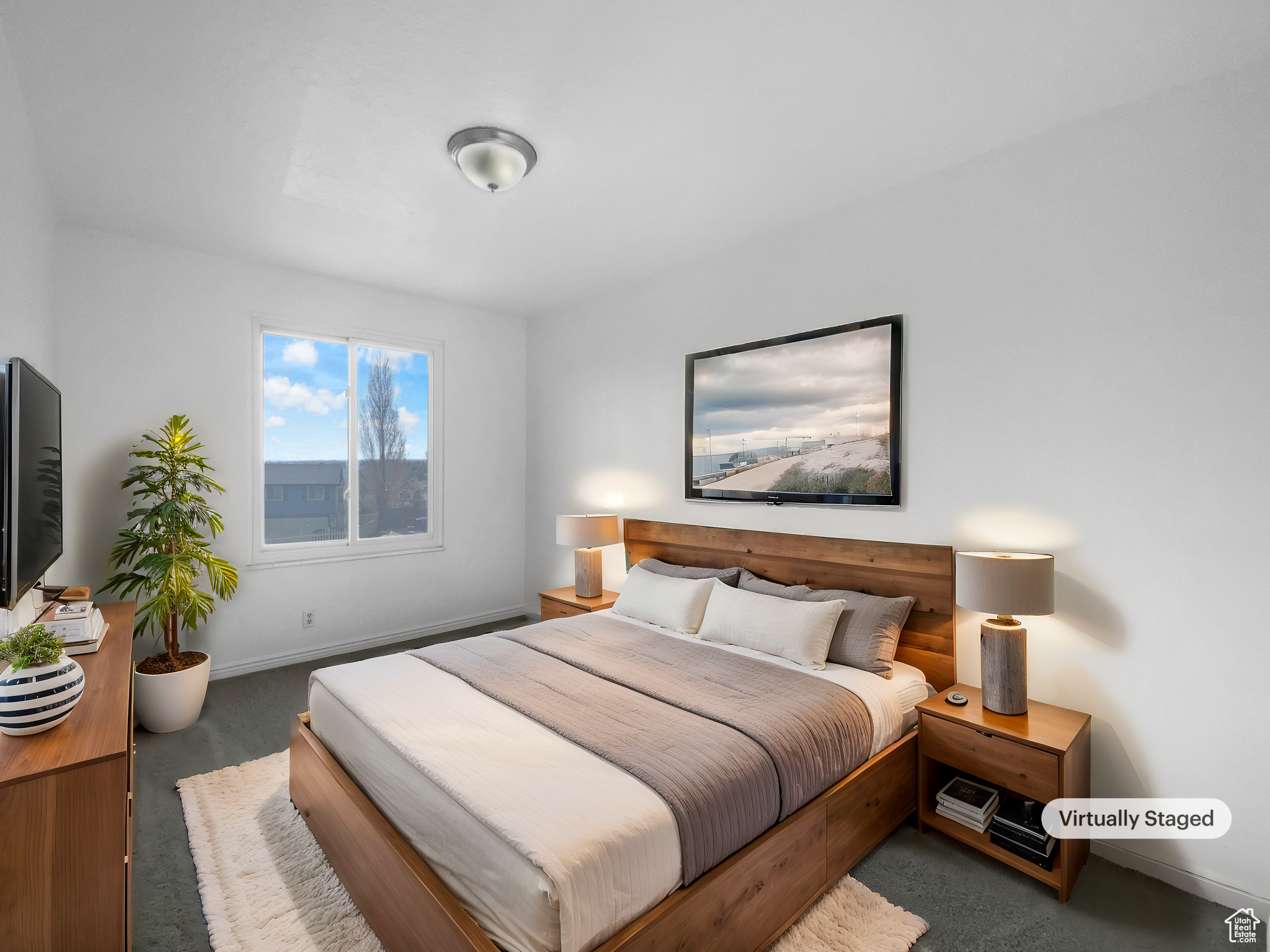 Bedroom featuring dark carpet
