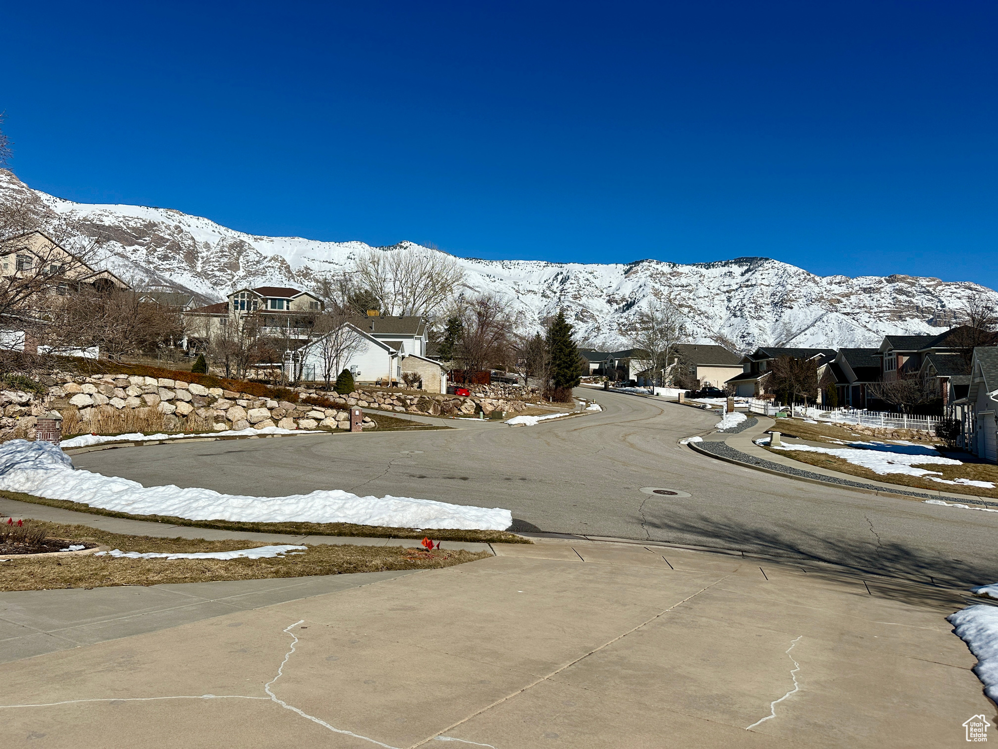 View of street with a residential view, a mountain view, and sidewalks