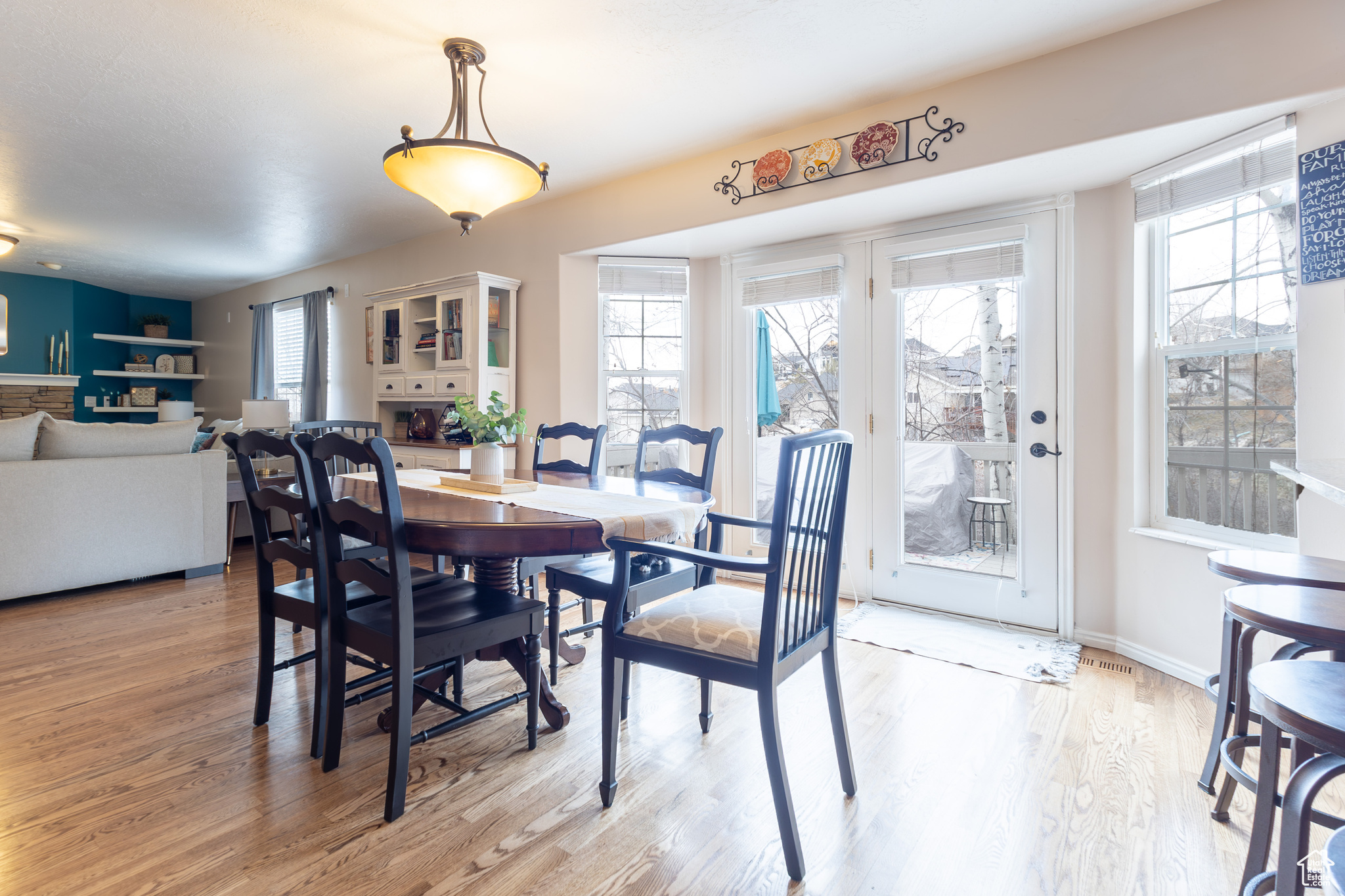 Dining area with plenty of natural light and light wood-type flooring