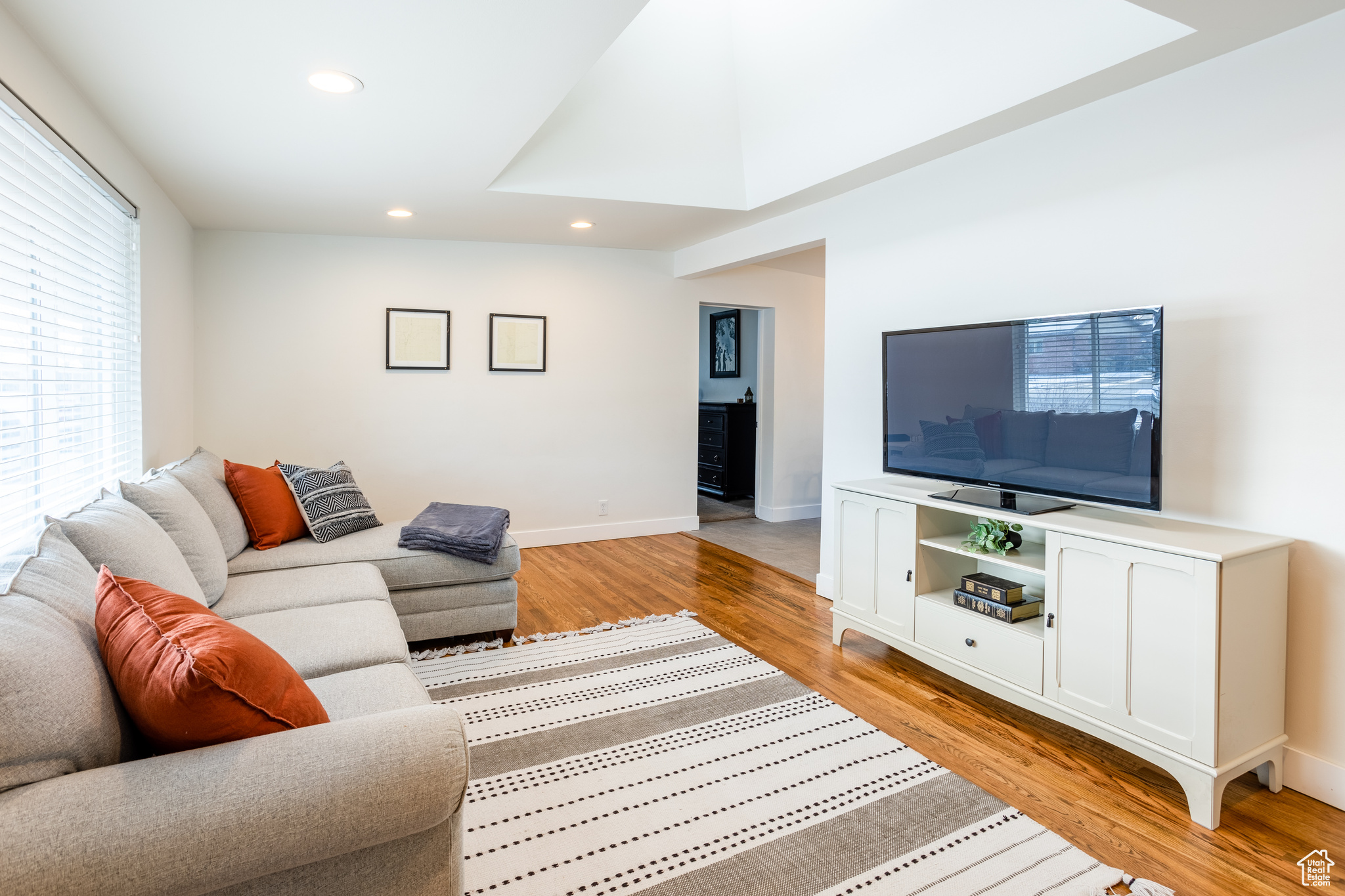 Living room with light wood-type flooring