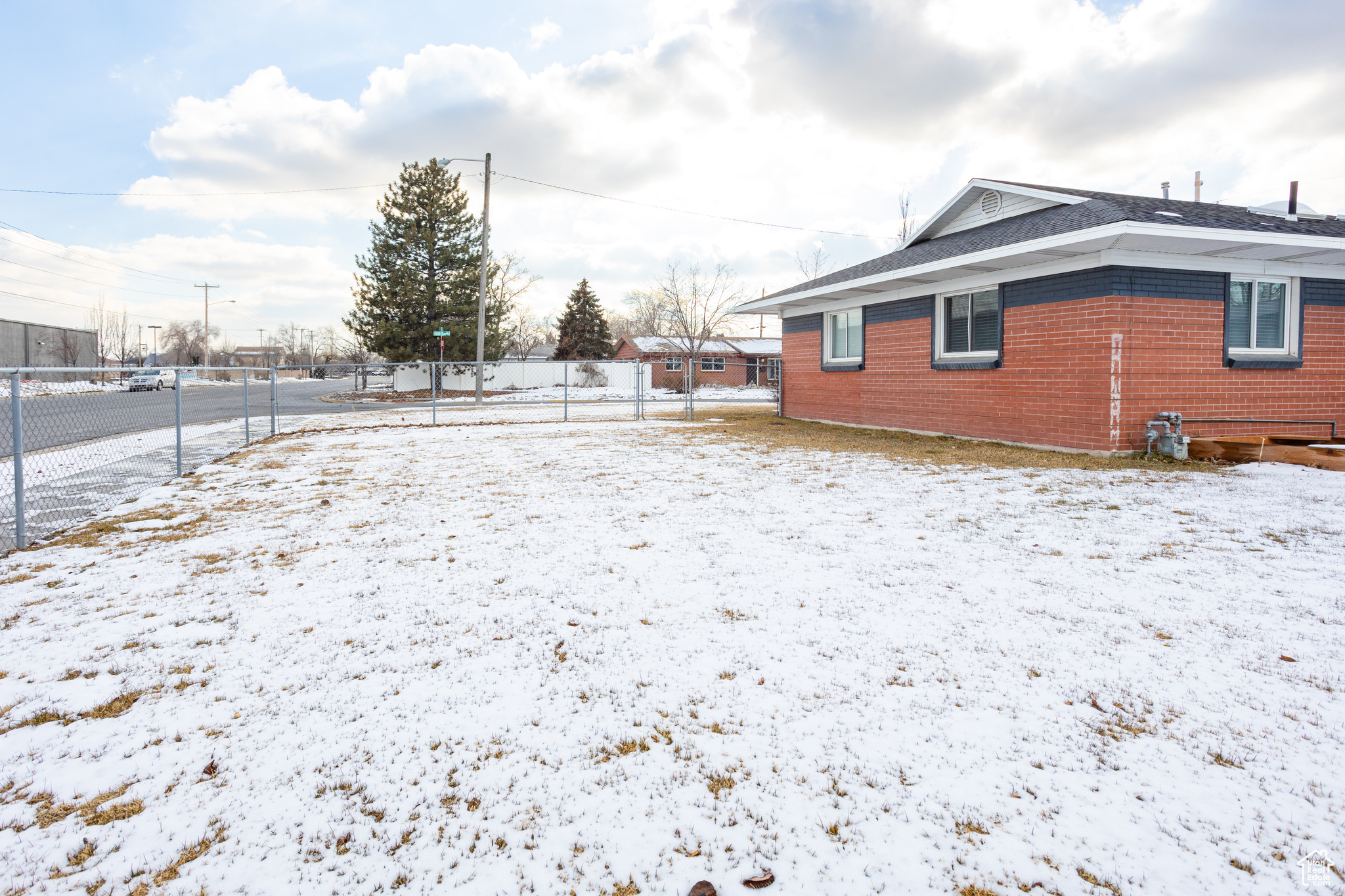 View of yard layered in snow