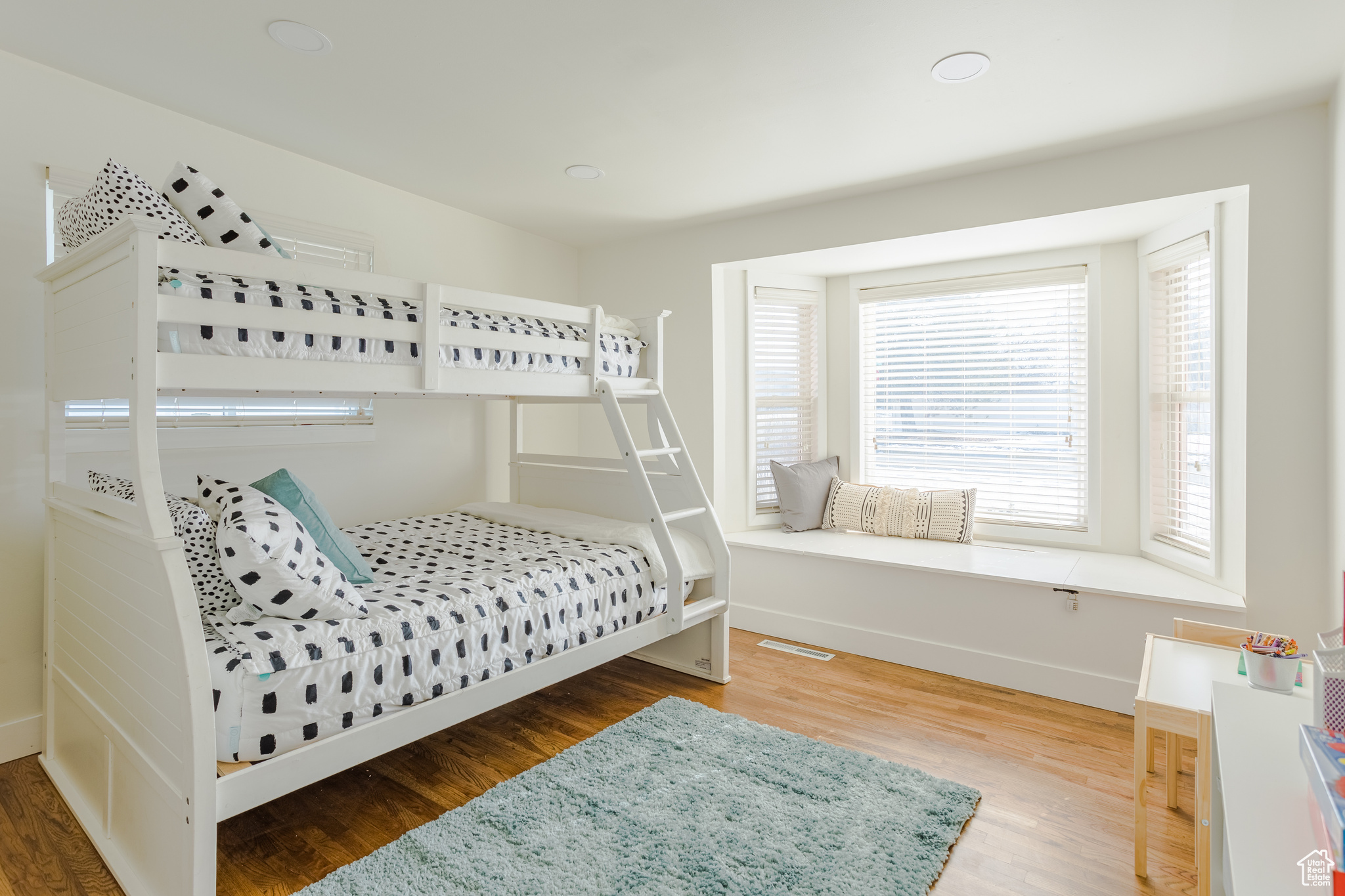 Bedroom with hardwood / wood-style floors