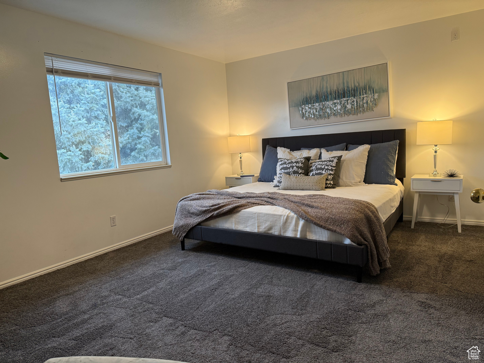 Carpeted bedroom with baseboards