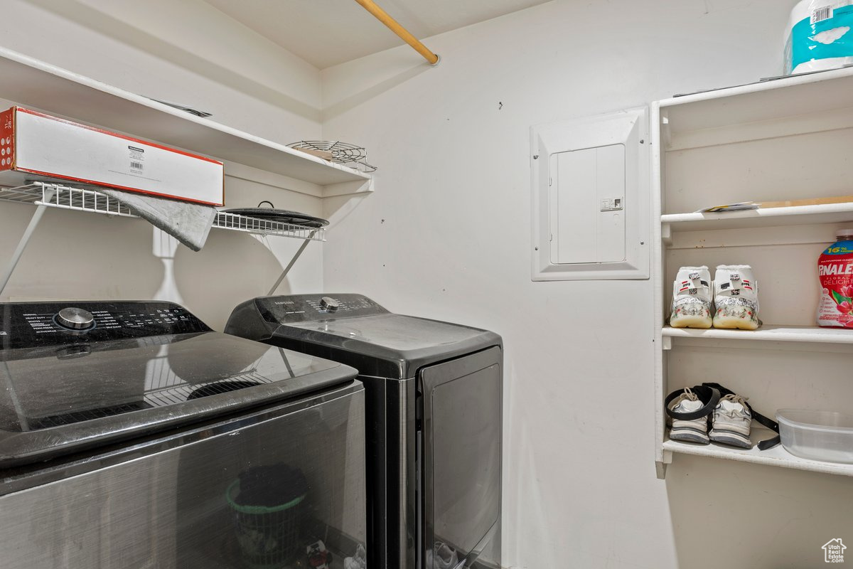 Laundry area with separate washer and dryer and electric panel