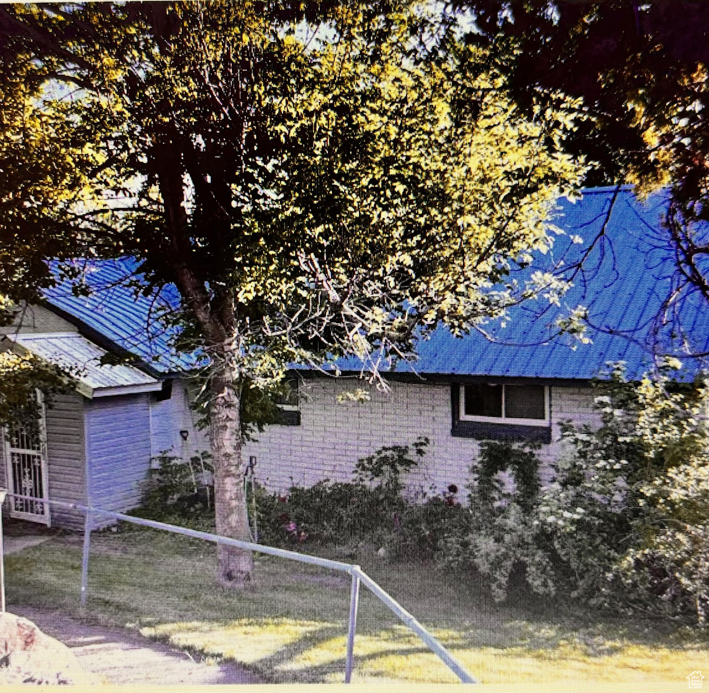 View of side of property featuring fence