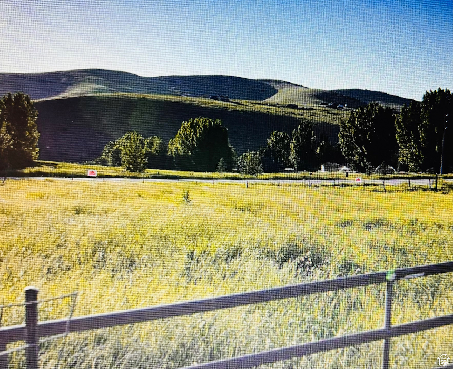 Property view of mountains with a rural view