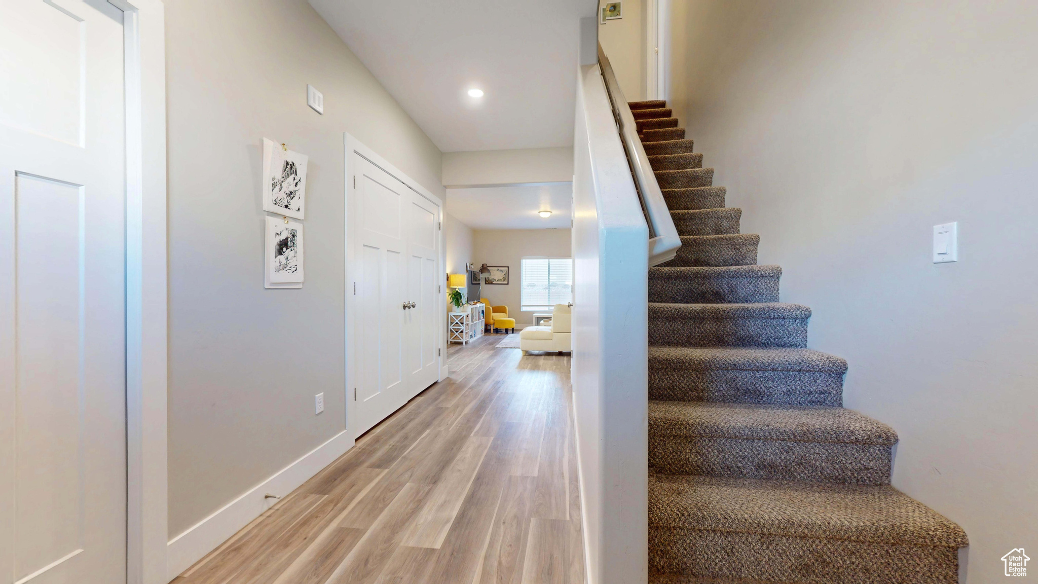 Staircase featuring hardwood / wood-style floors