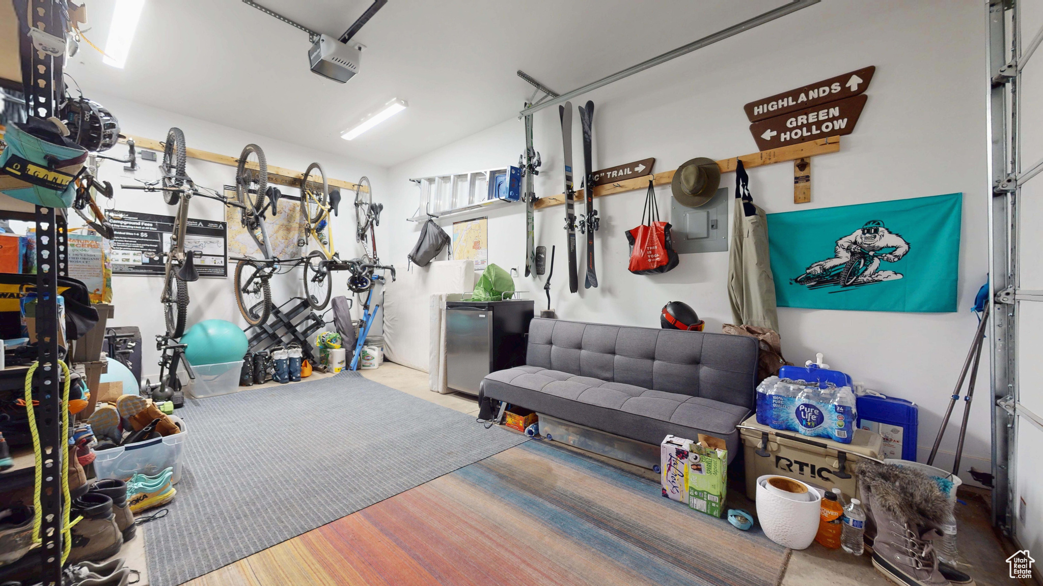Garage with a garage door opener and refrigerator