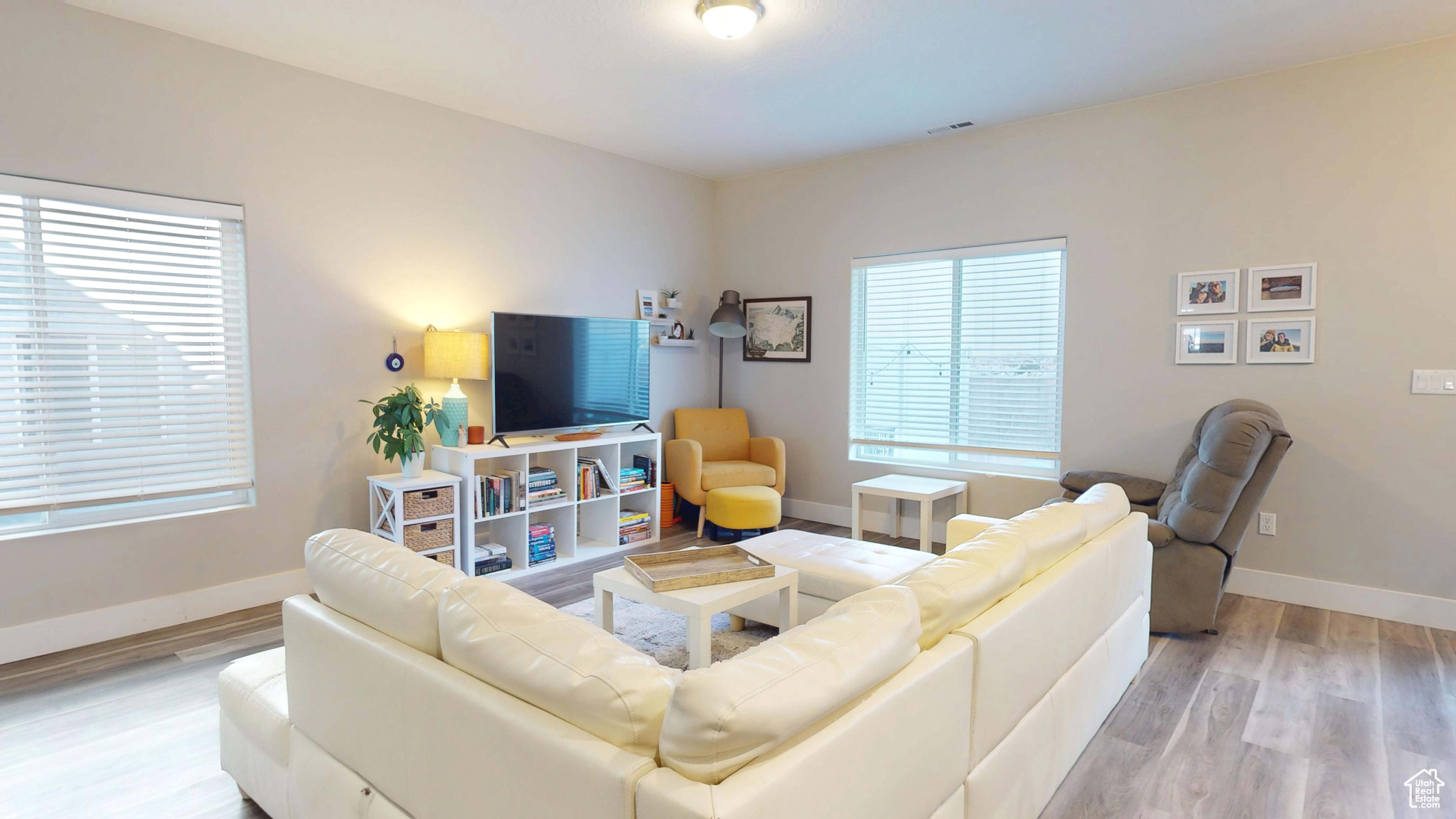 Living room with light wood-type flooring