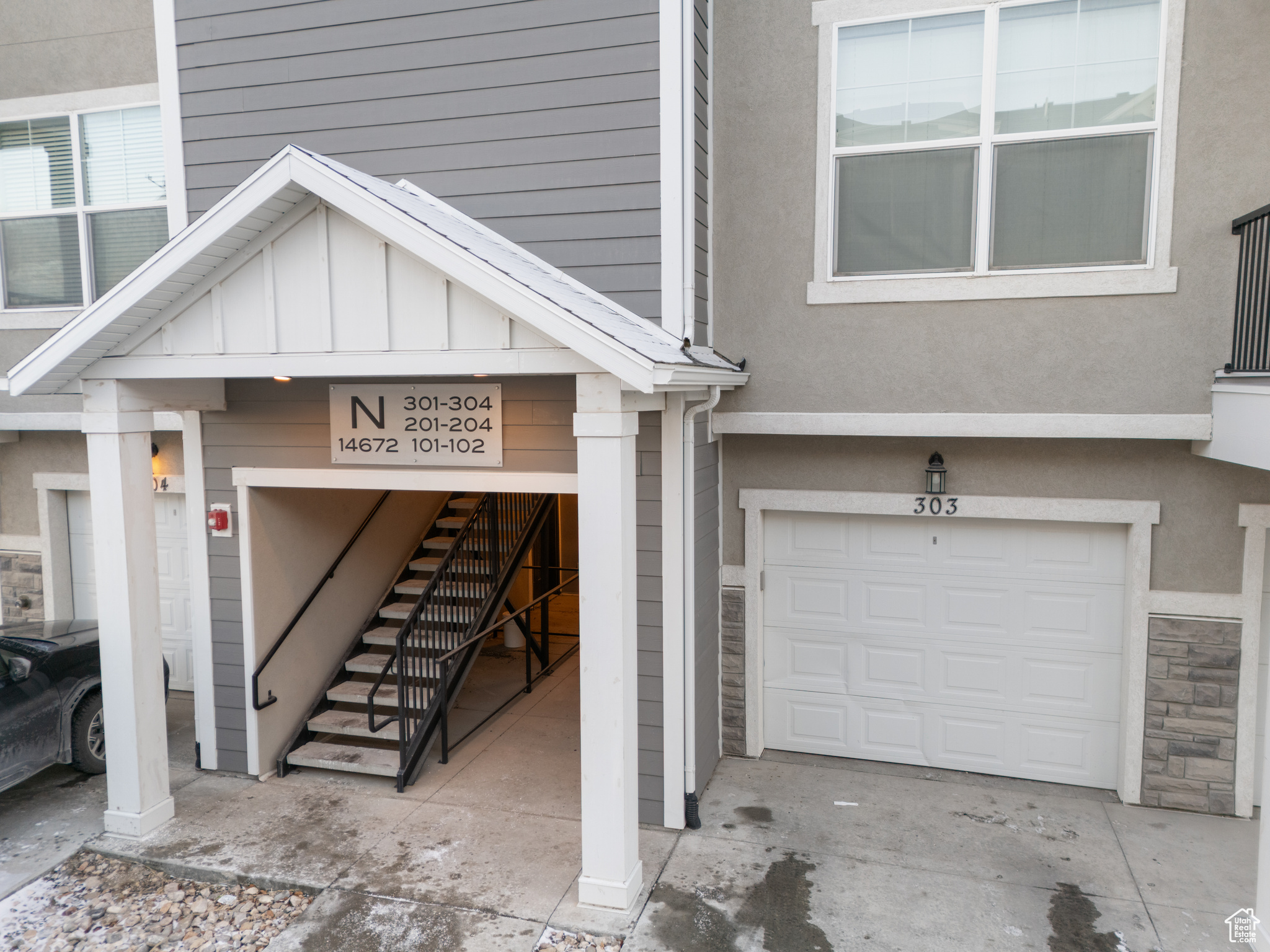 Doorway to property featuring a garage