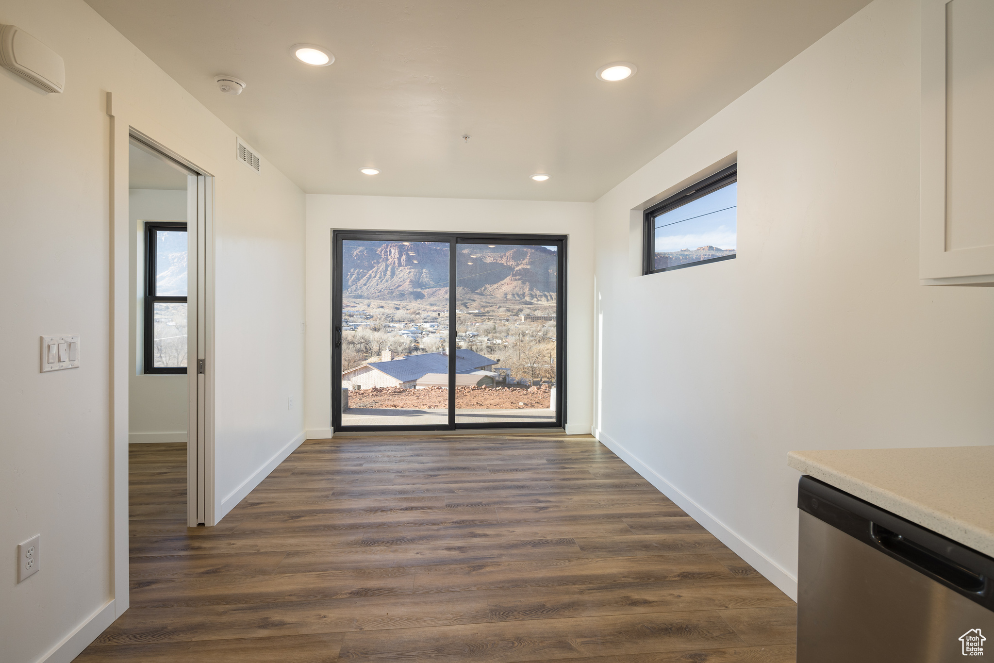 Hall featuring dark wood-type flooring