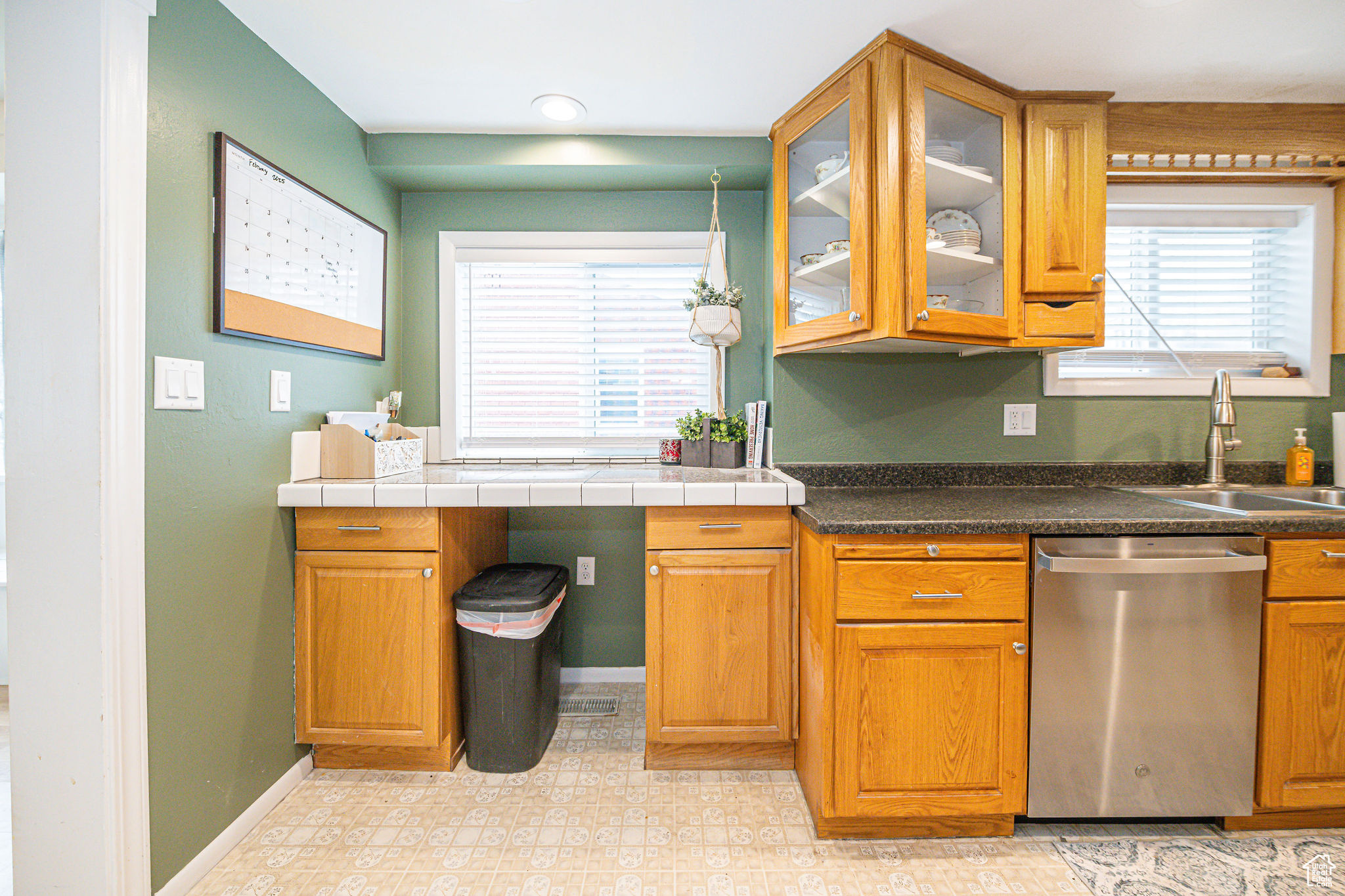 Kitchen with a healthy amount of sunlight, sink, and dishwasher