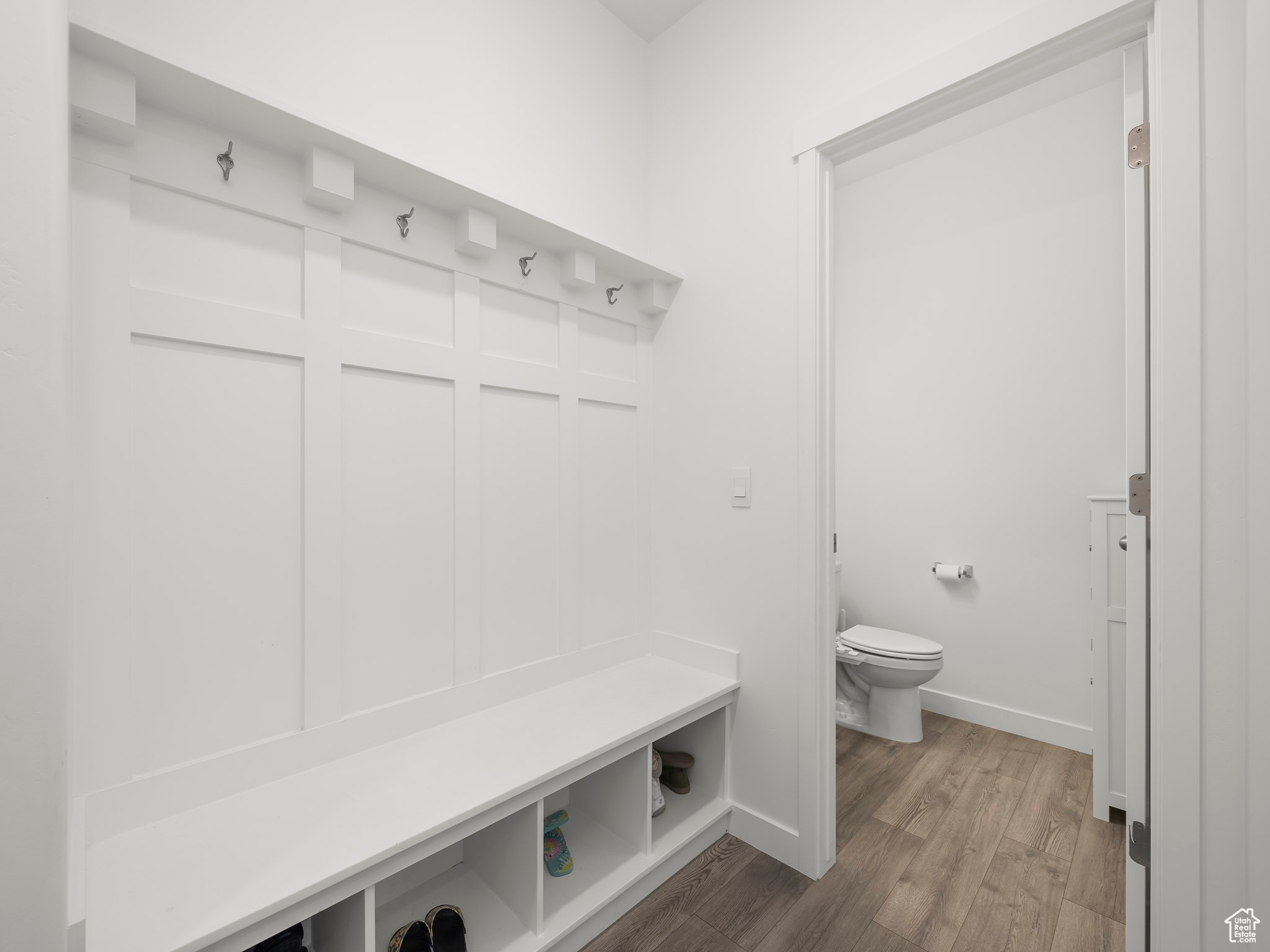 Mudroom with hardwood / wood-style flooring