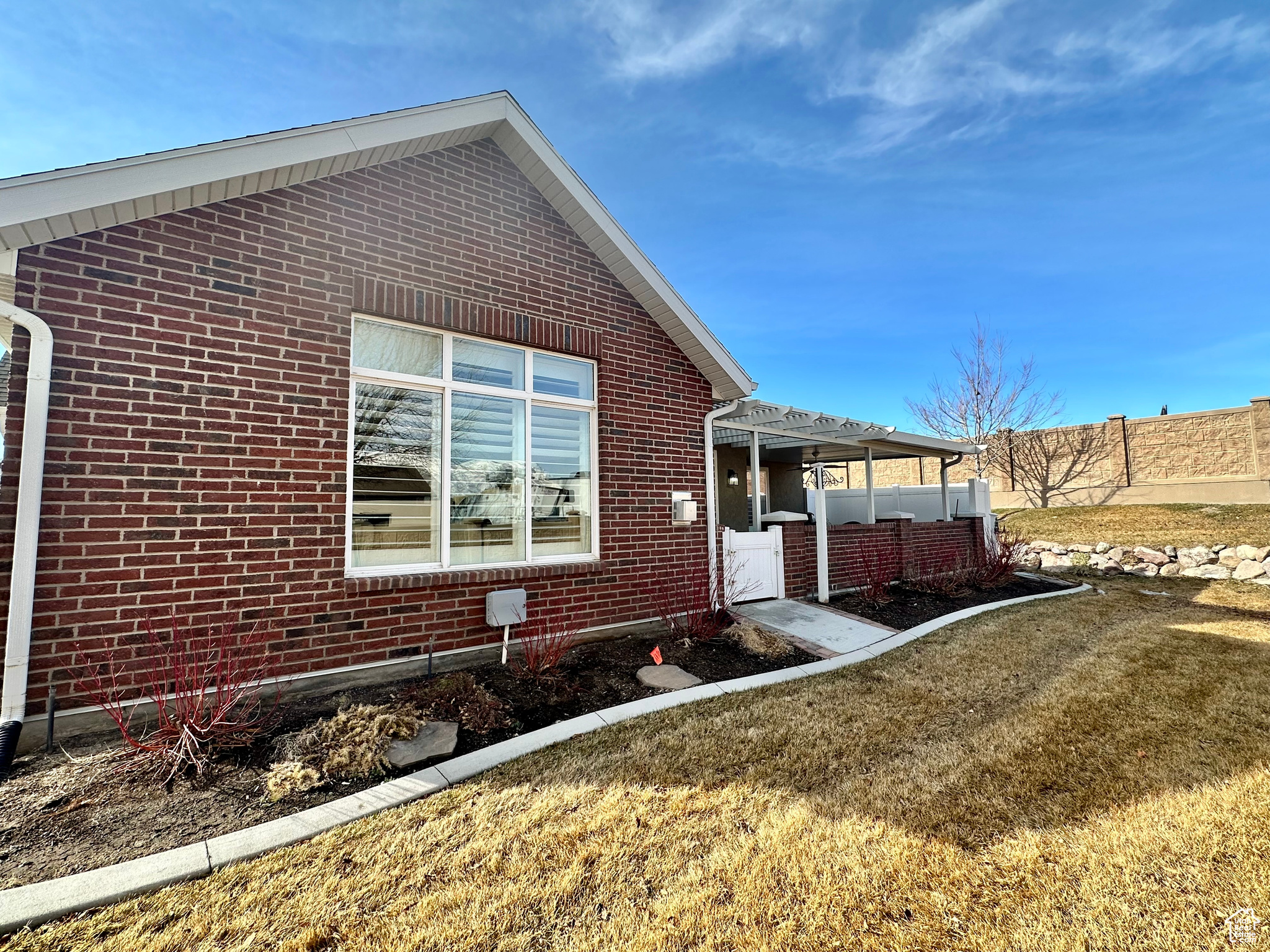 View of home's exterior featuring brick siding