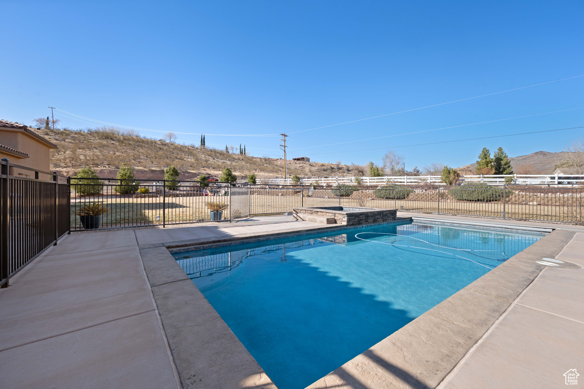 View of swimming pool featuring a mountain view and a patio area