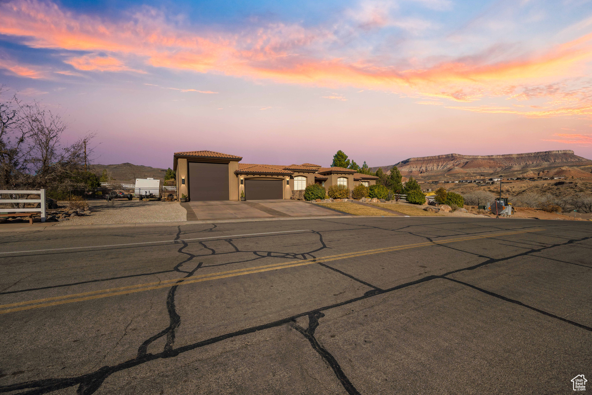 View of front of home featuring a mountain view and a garage
