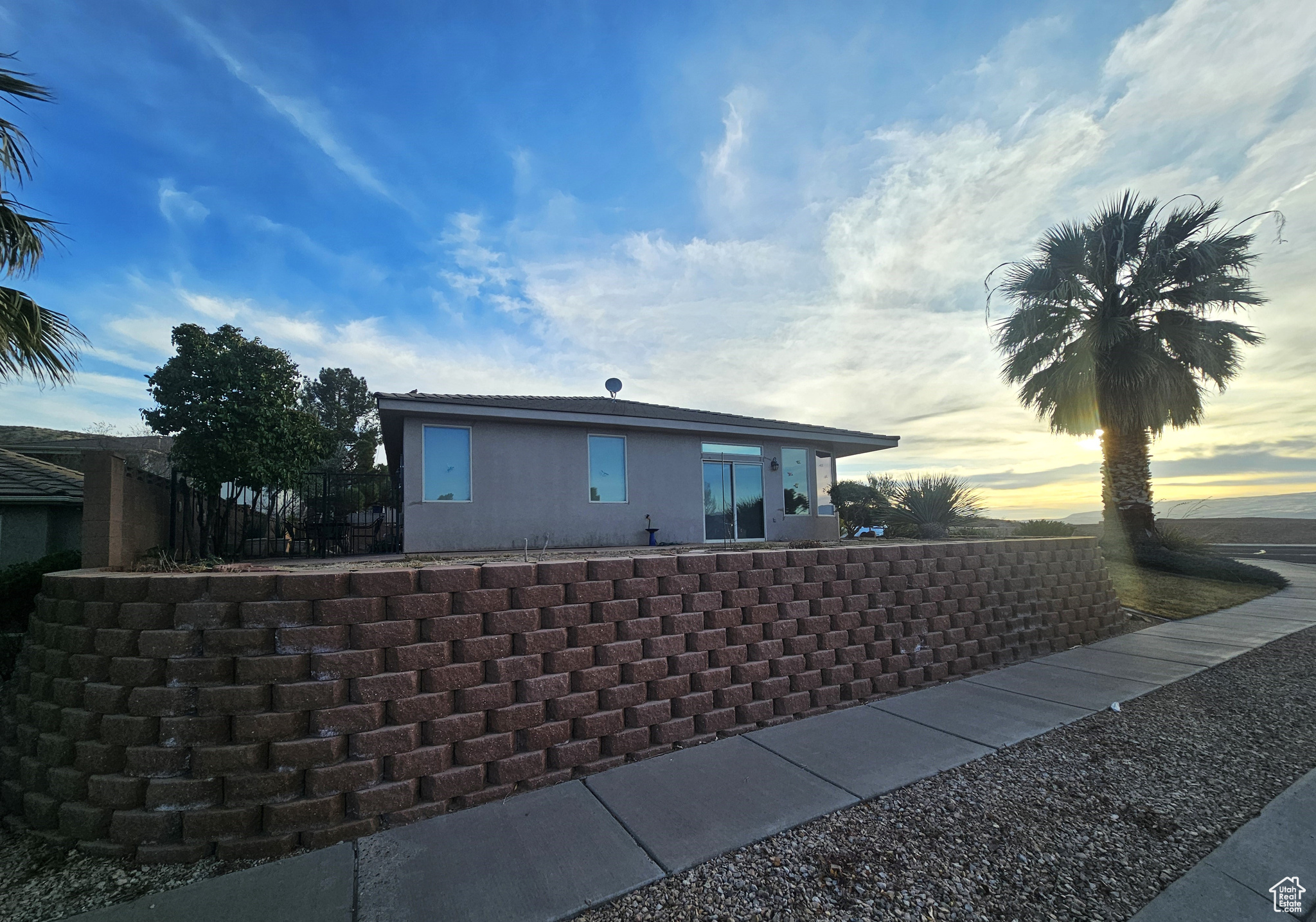View of property exterior at dusk