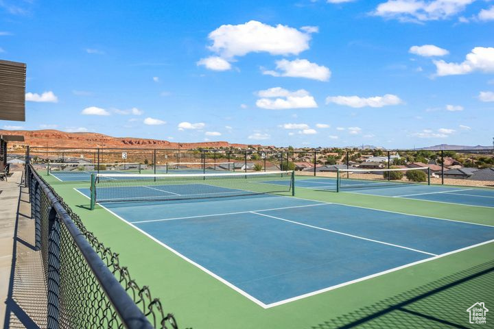 View of tennis court featuring a mountain view